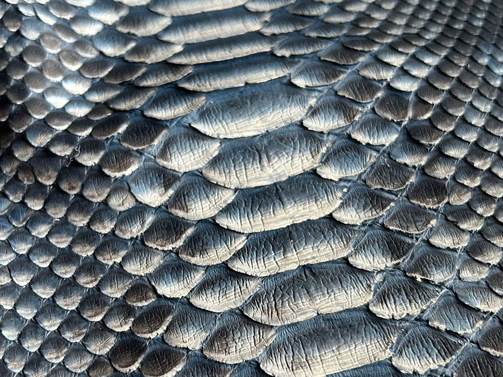 Snakeskin-pattern biker jacket fabric with dark blue gradient texture