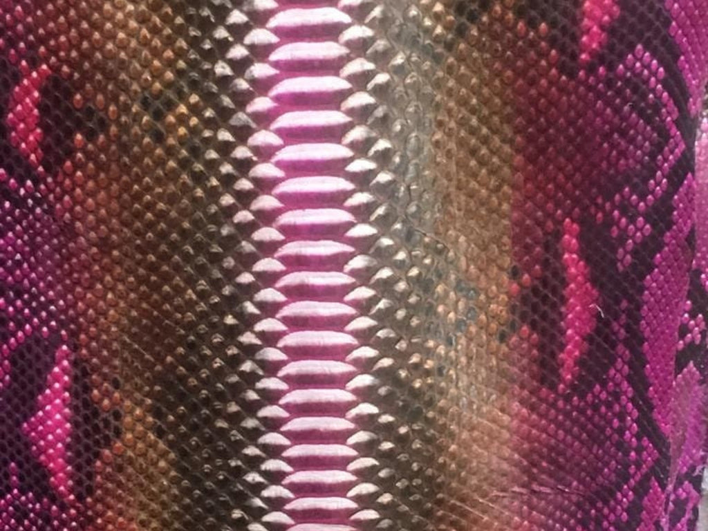 Close-up of pink and metallic brown python snakeskin leather texture