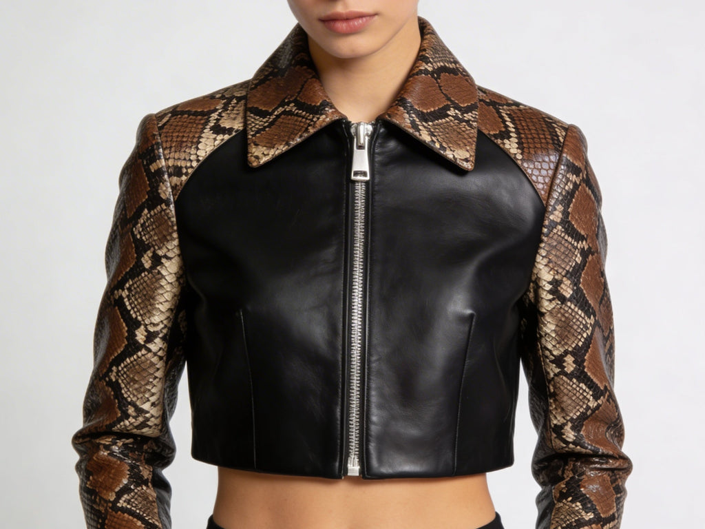 Cropped motorcycle jacket with black front, brown snakeskin sleeves, and silver zip.