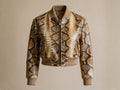Cropped snakeskin bomber jacket with front zip and ribbed collar, cuffs, and hem