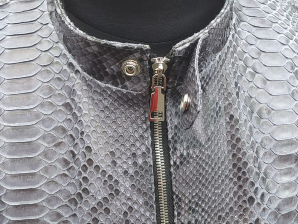 Snakeskin leather jacket neckline with snap button, high collar, and zipper pull