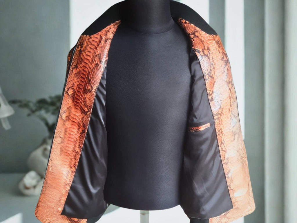 Brown leather bomber jacket interior lining visible; open front with black trim
