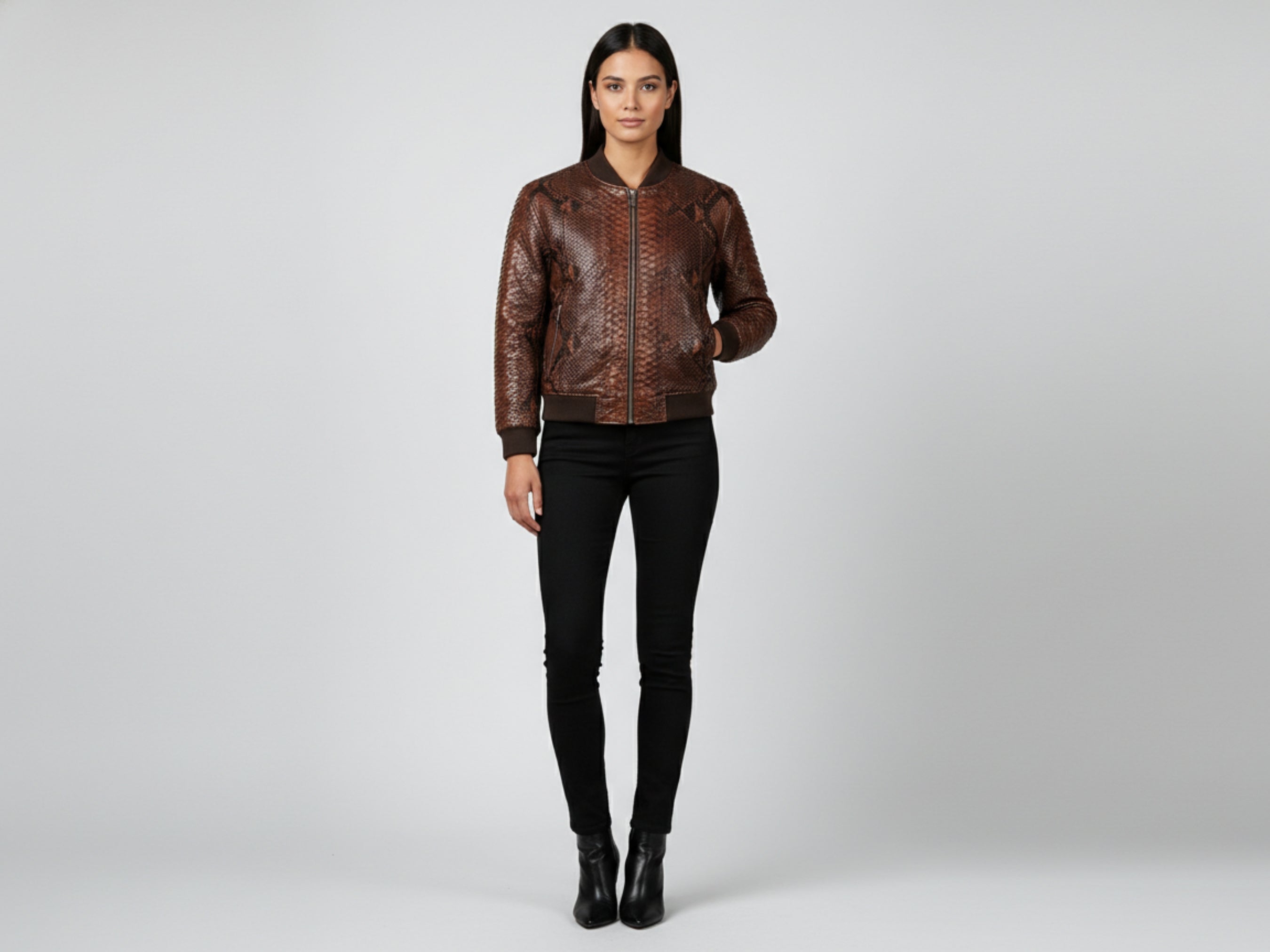 Brown snakeskin leather bomber jacket on model, front zip and ribbed cuffs