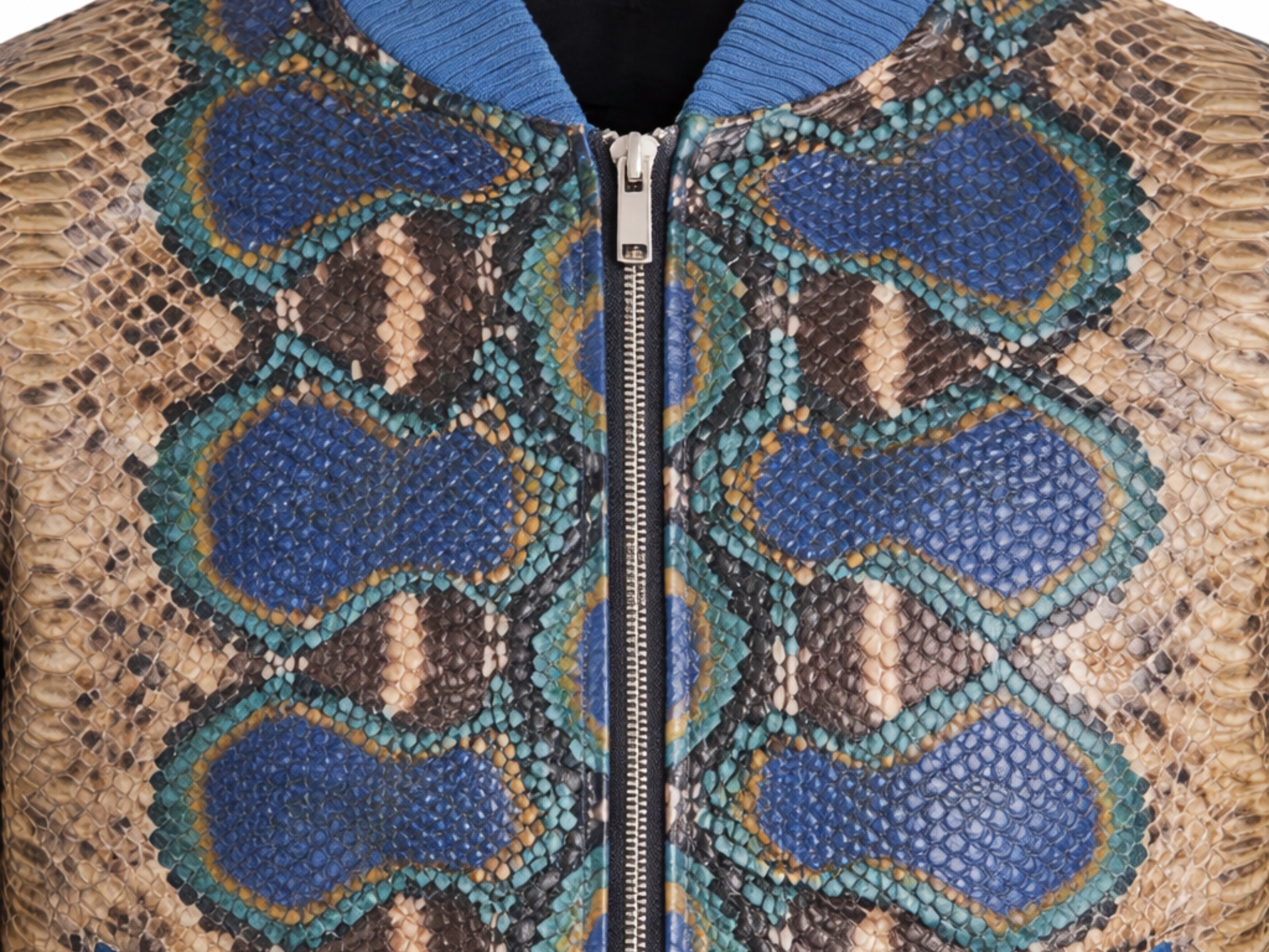 Python snakeskin bomber jacket detail, close-up of front zipper and blue-and-tan pattern