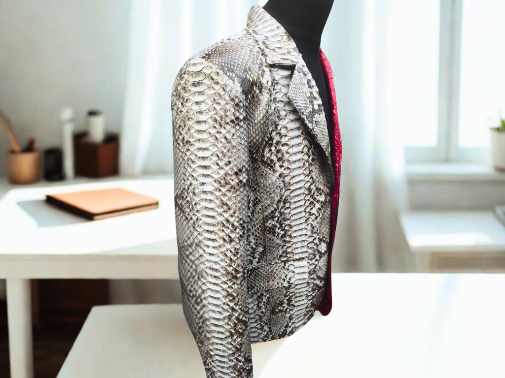 Snakeskin blazer side view, silver snake-print with red inner panel detail.