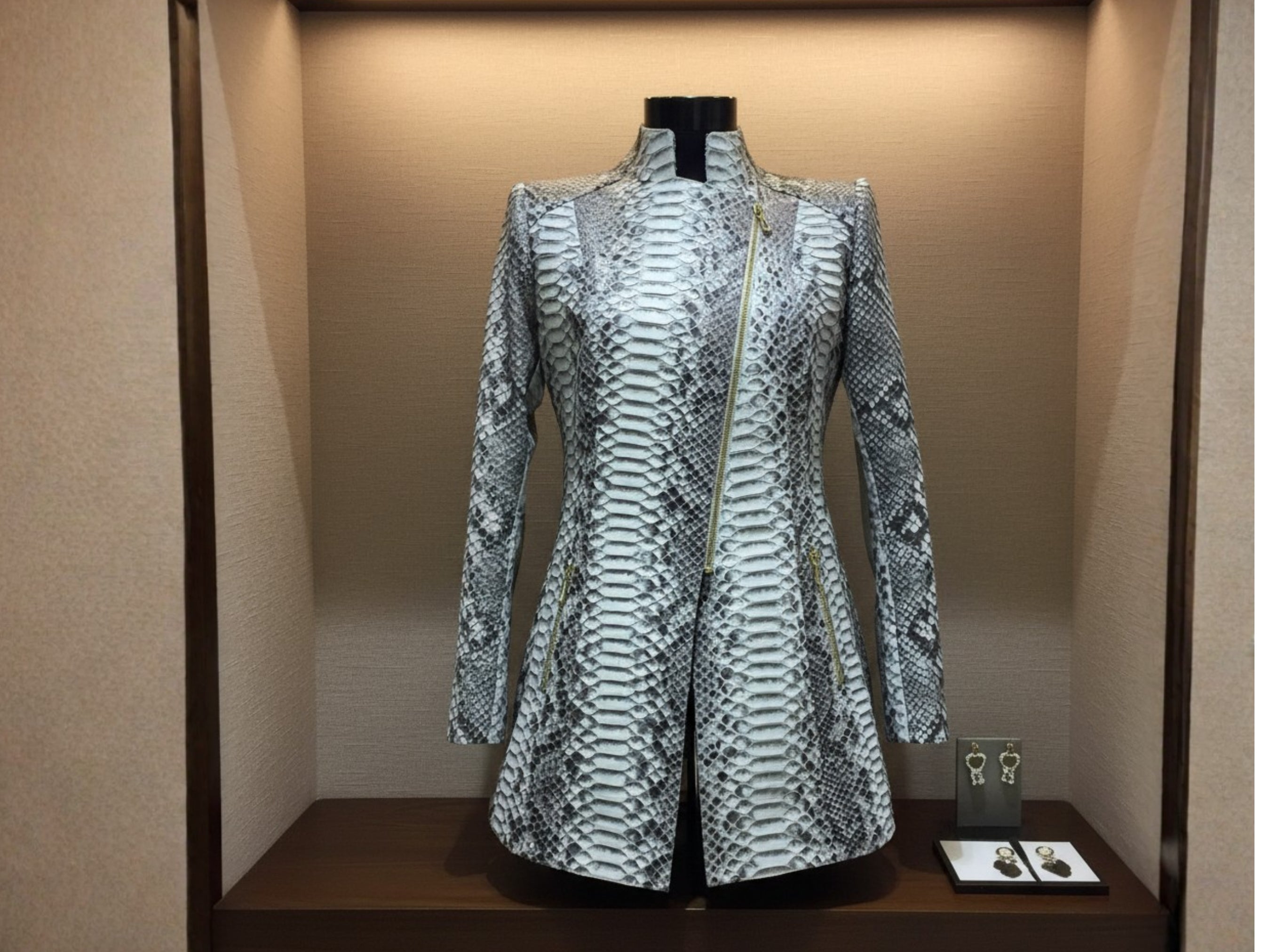 Gray python snakeskin jacket with asymmetrical zip front and tailored A-line shape