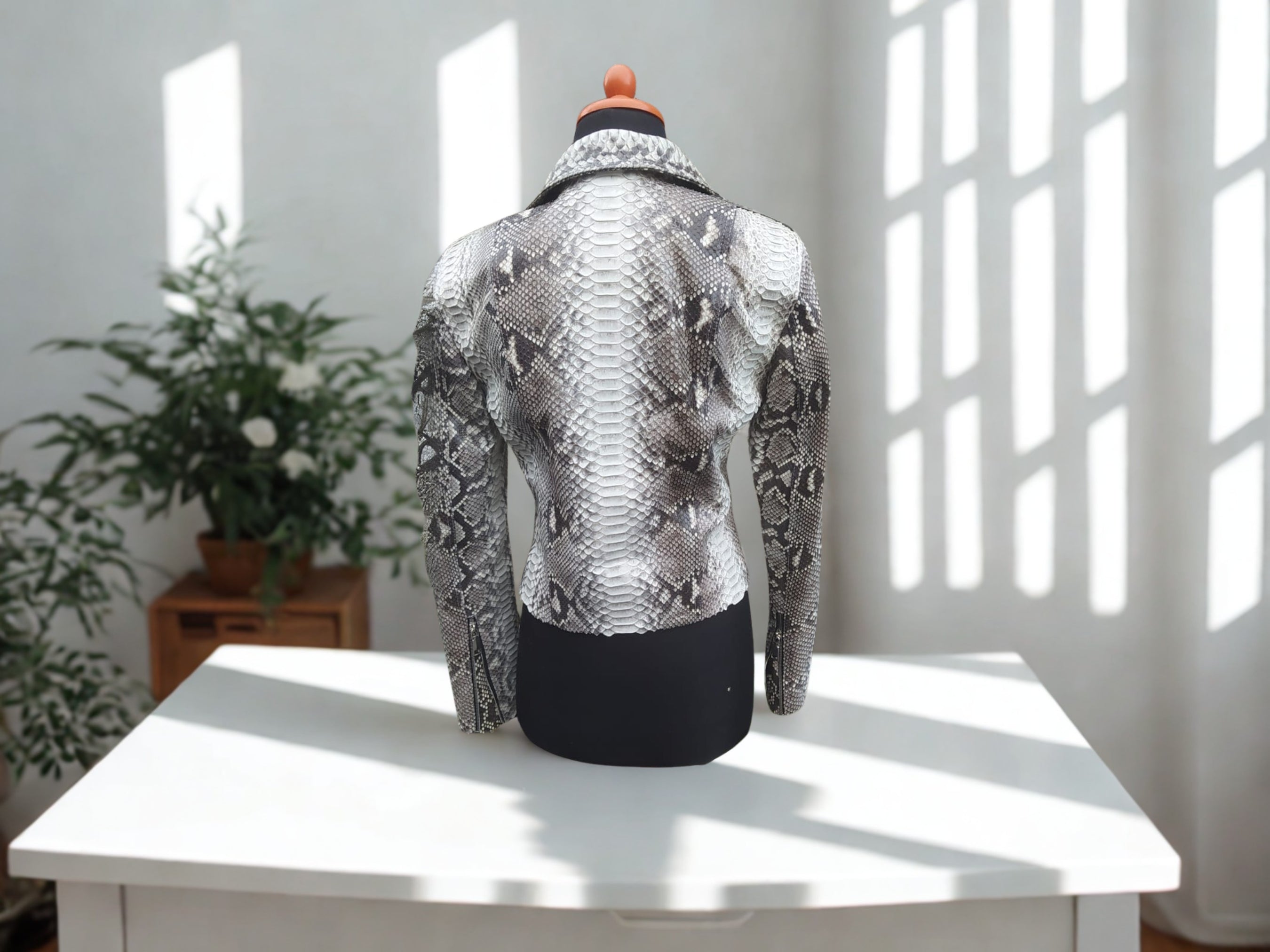 Snakeskin-print biker jacket, full back view, silver-gray textured pattern