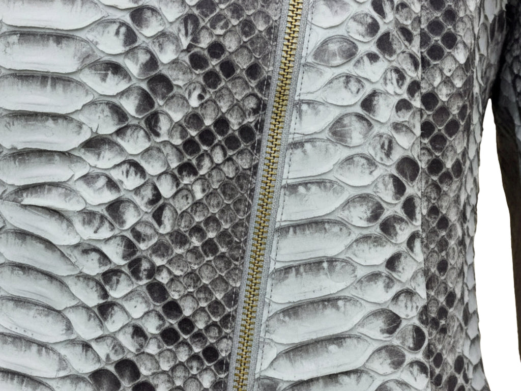Close-up of gray python snakeskin texture with gold-toned asymmetrical zipper