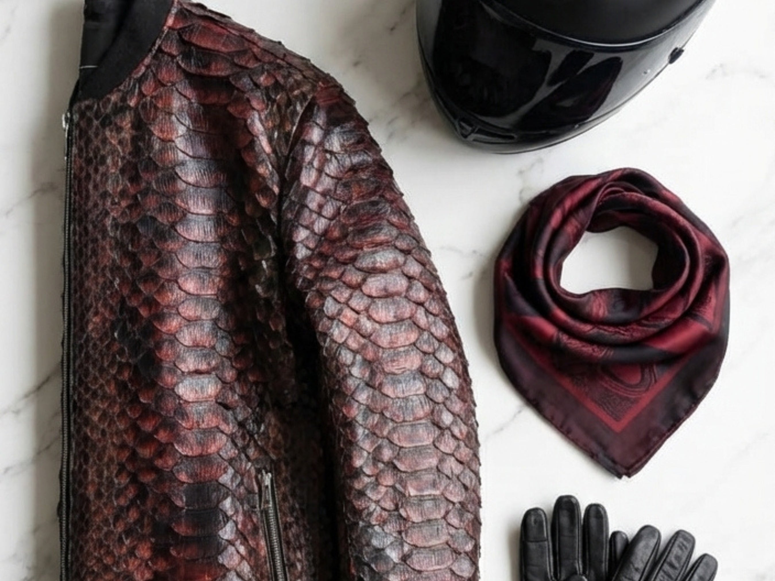 Snakeskin-pattern bomber jacket sleeve with zip detail and ribbed cuff