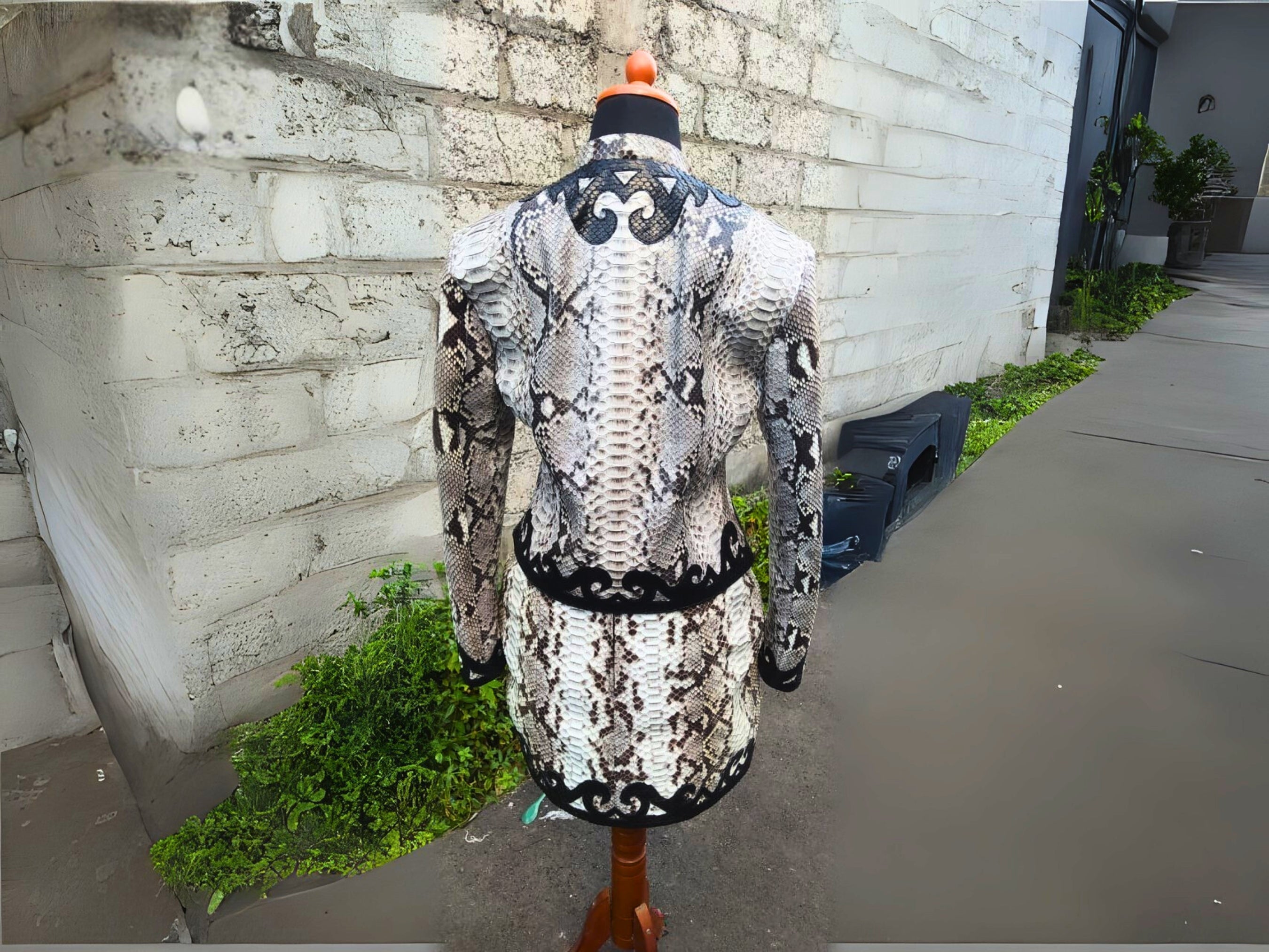 Snakeskin-print jacket and skirt set with black ornate back panel detail