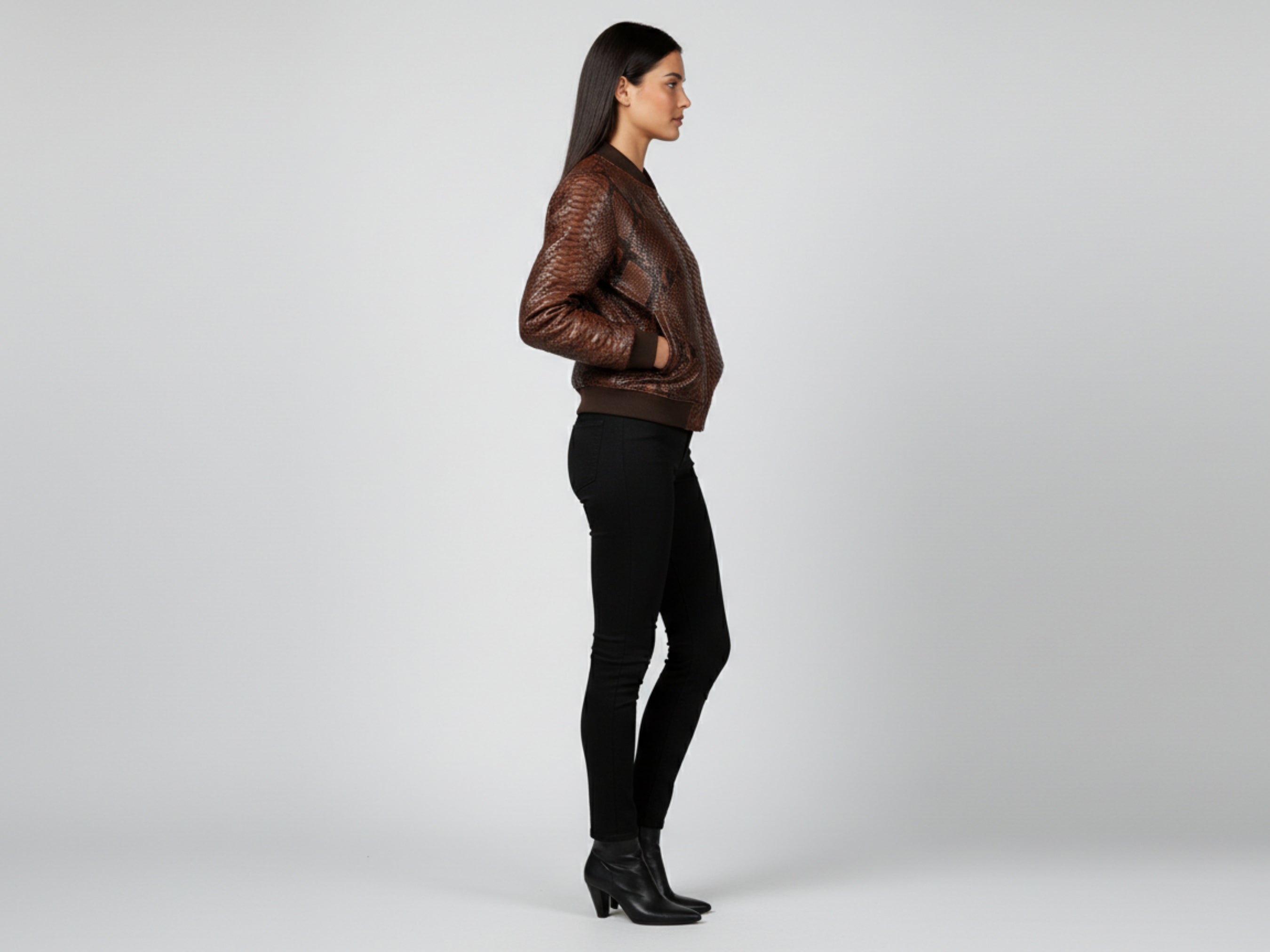 Brown snakeskin leather bomber jacket, back-left side view with ribbed cuffs