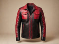 Red snakeskin-style jacket with black leather sleeves, front zipper, and flap chest pockets