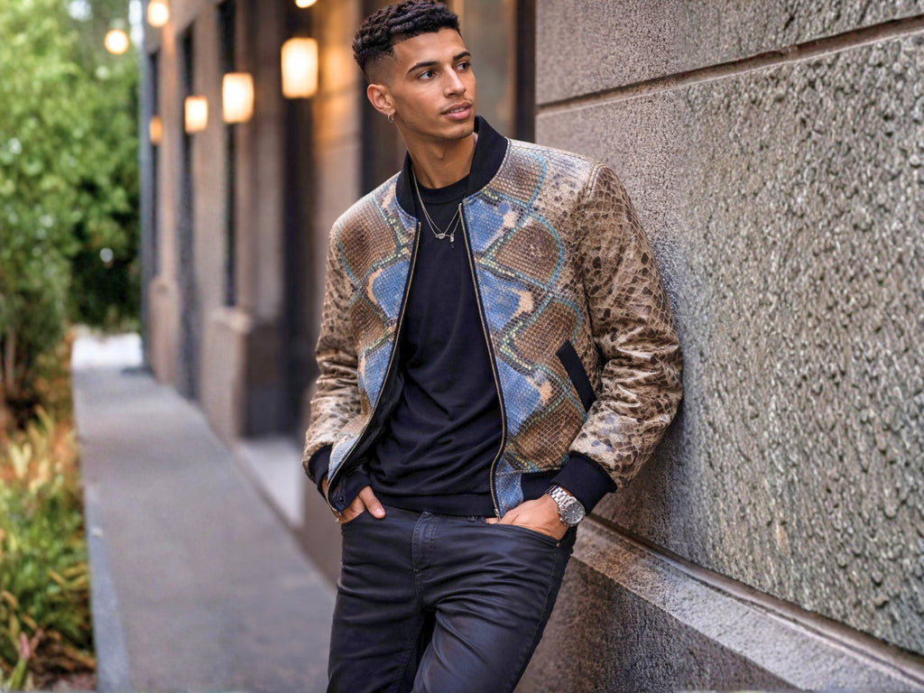 Men’s python snakeskin bomber jacket worn near wall, showing zip front and ribbed hem