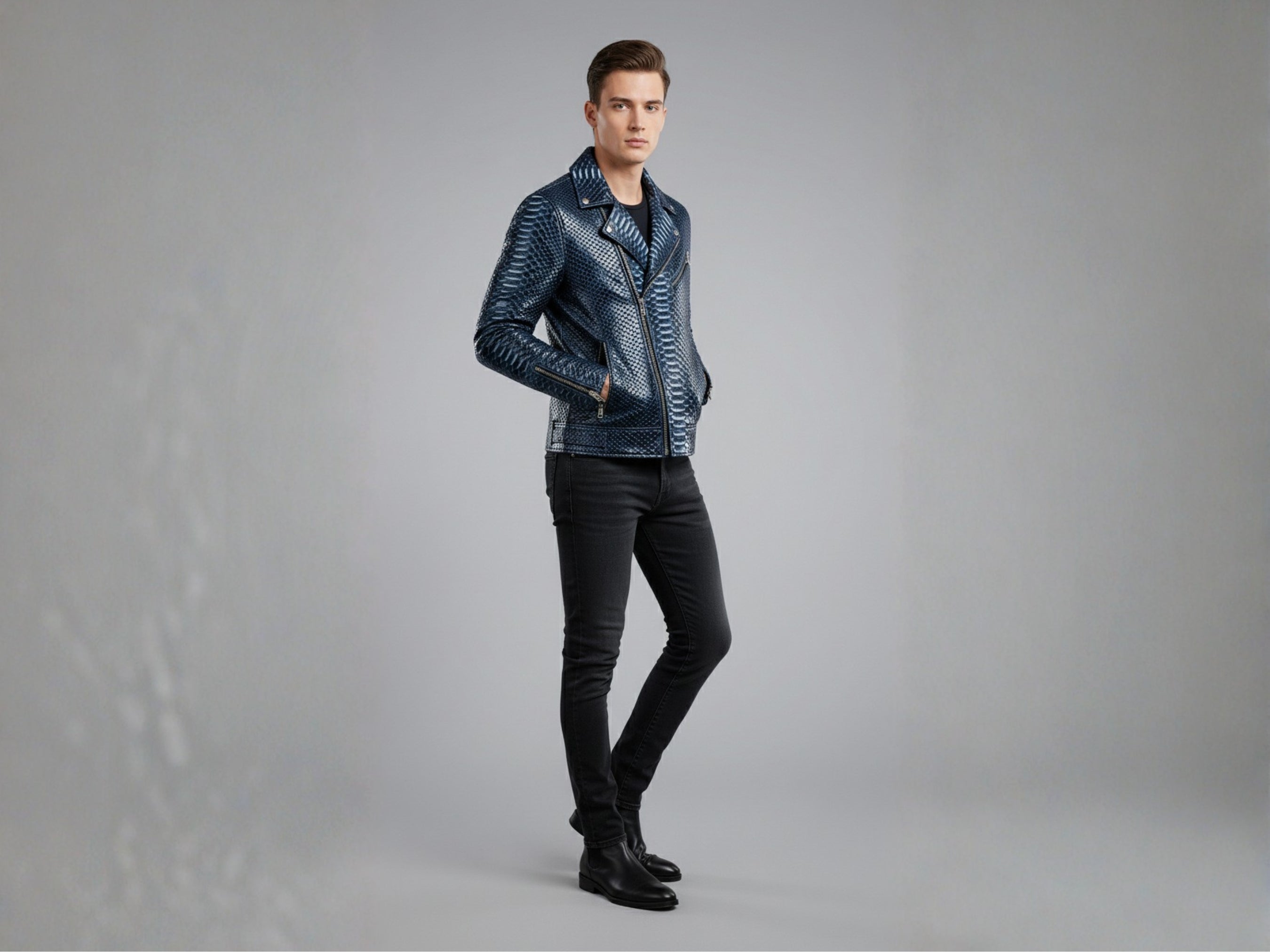 Dark blue python snakeskin biker jacket with stand collar and zipper pockets, standing view.