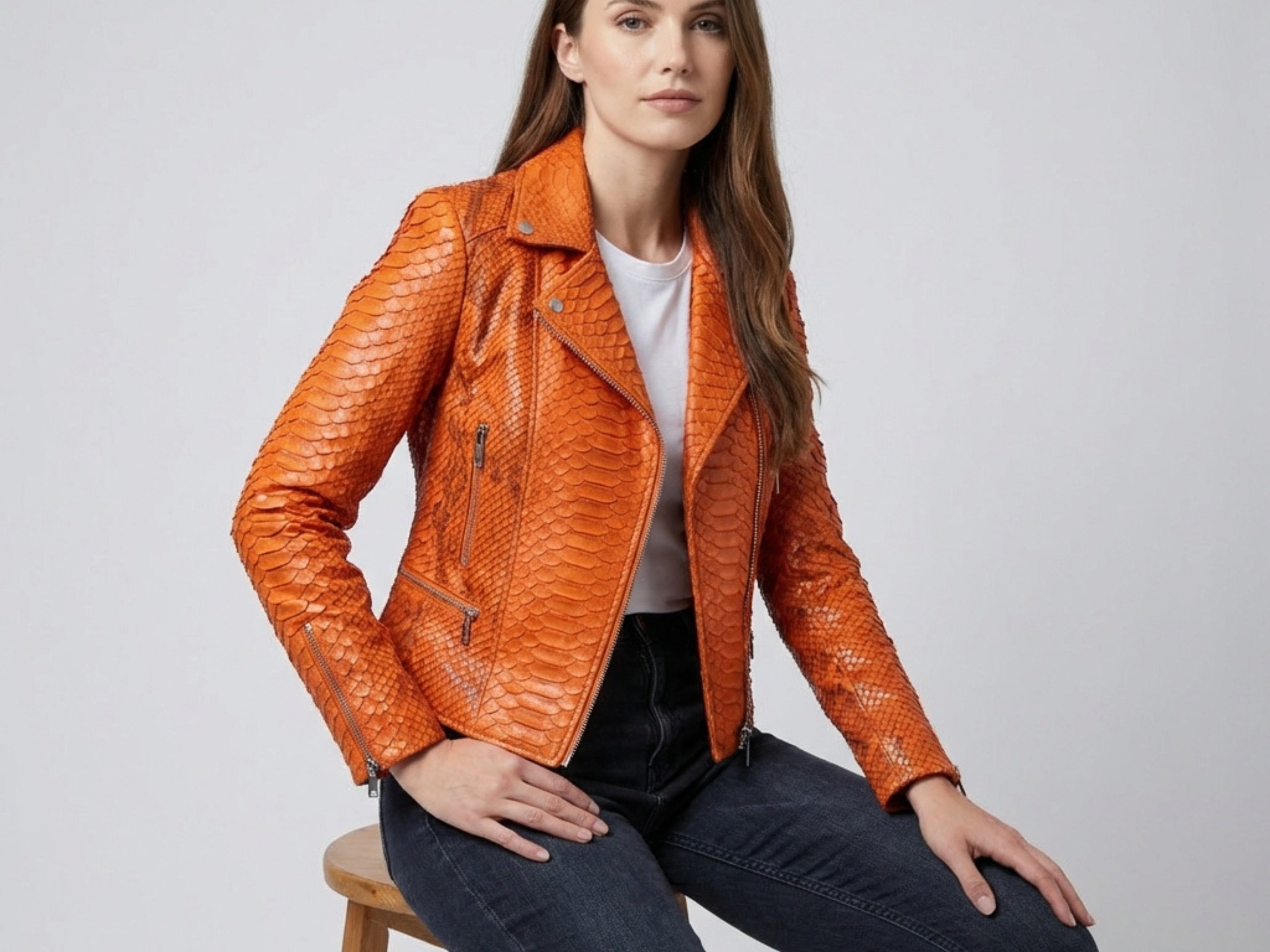 Burnt orange snakeskin-texture leather biker jacket with asymmetrical zip, stand collar, zips on cuffs