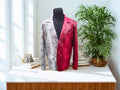 Snakeskin blazer with split red and silver snake-print, notch lapel.