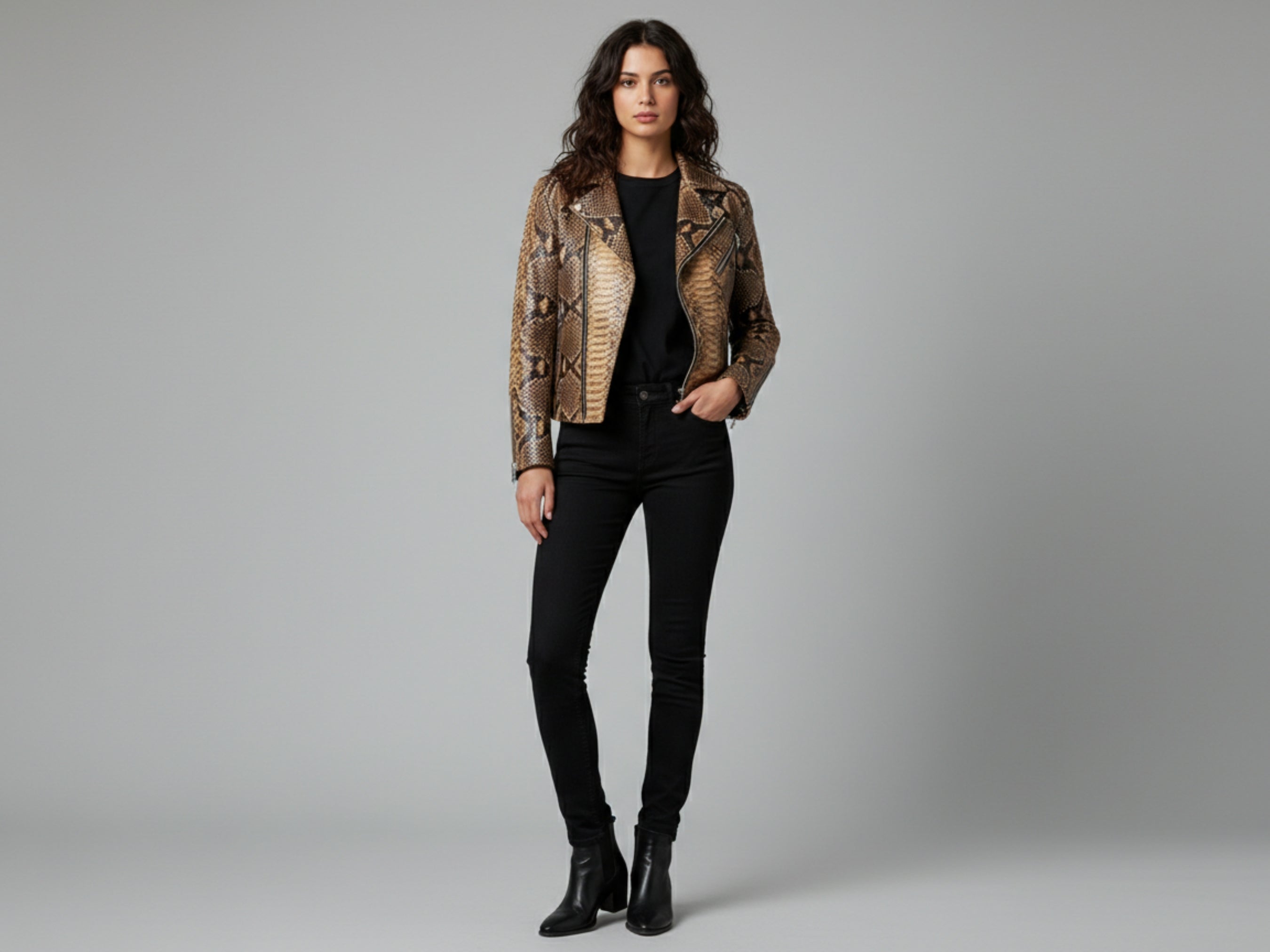 Natural brown snakeskin leather biker jacket on model, standing front with zip front