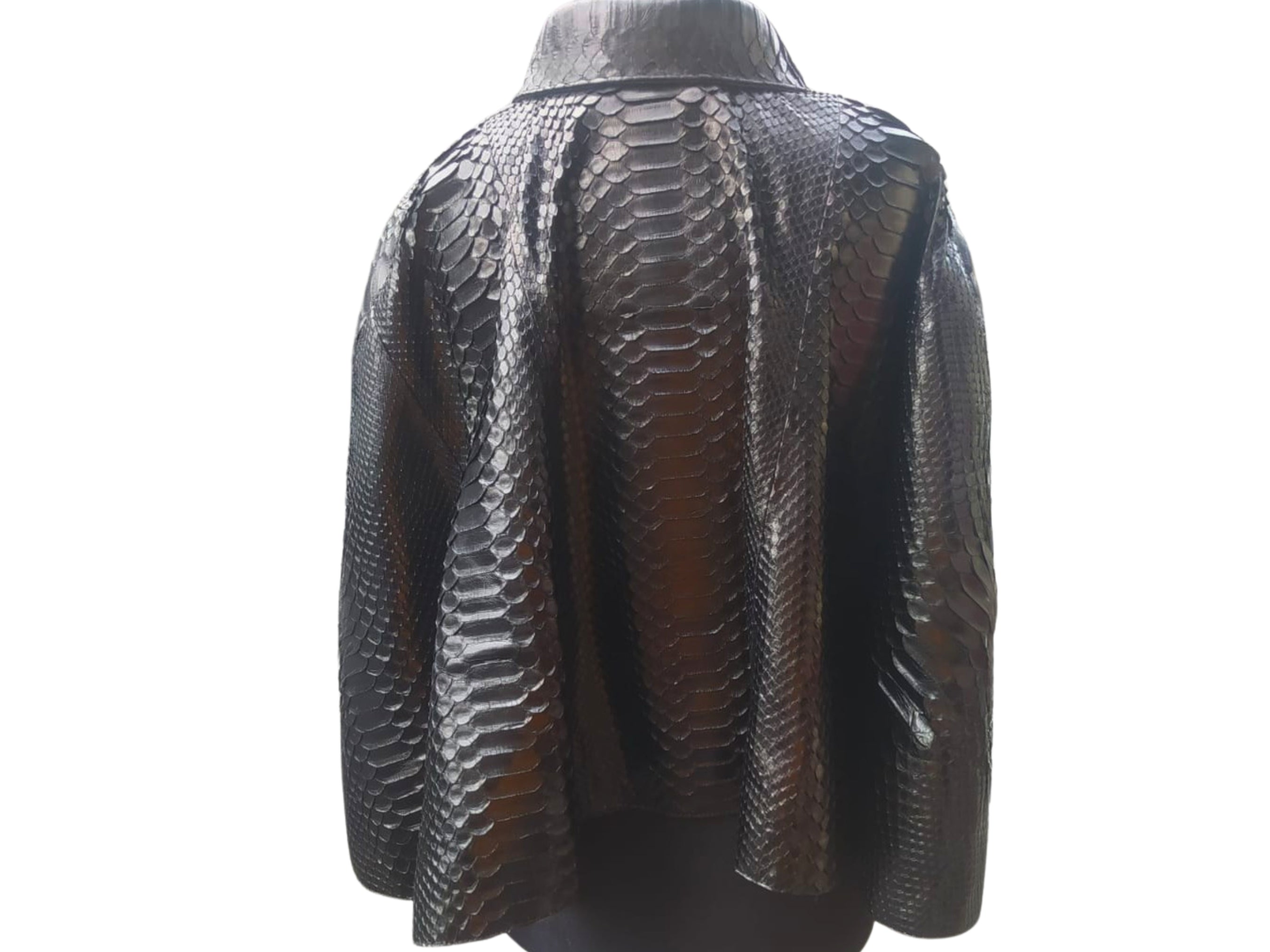 Snakeskin short leather cape, back view with dark and silver snake print, structured yoke
