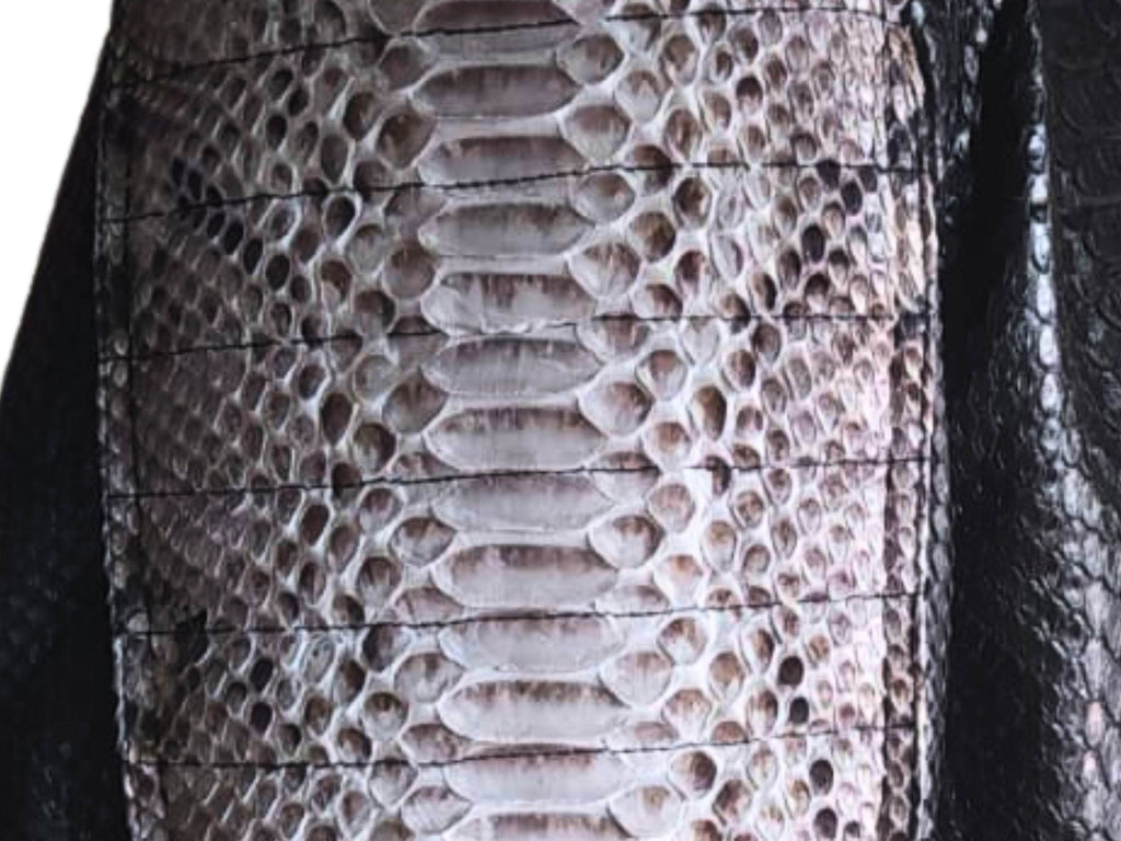 Cafe racer leather jacket close-up of snakeskin leather texture on front panel