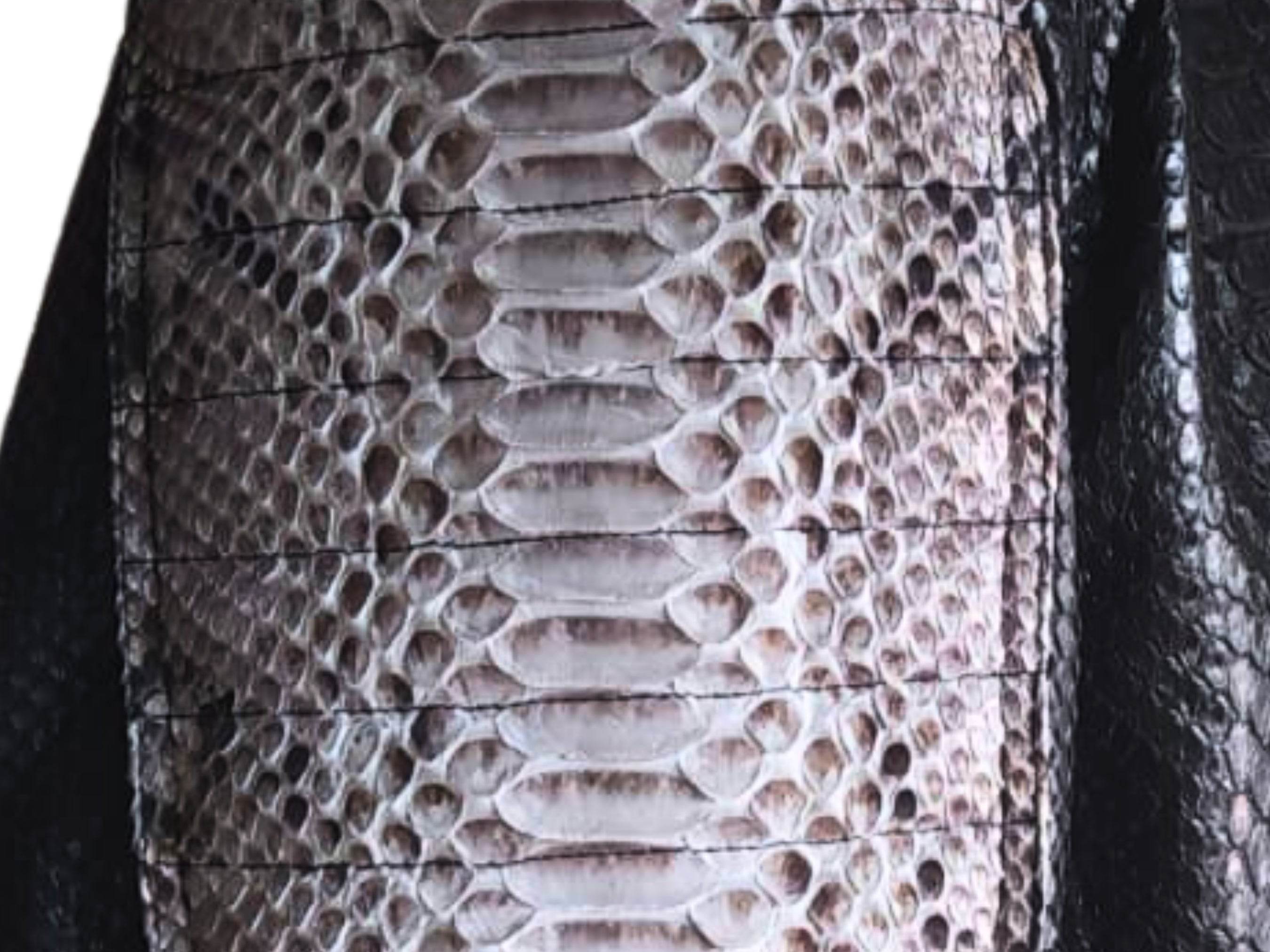 Cafe racer leather jacket close-up of snakeskin leather texture on front panel
