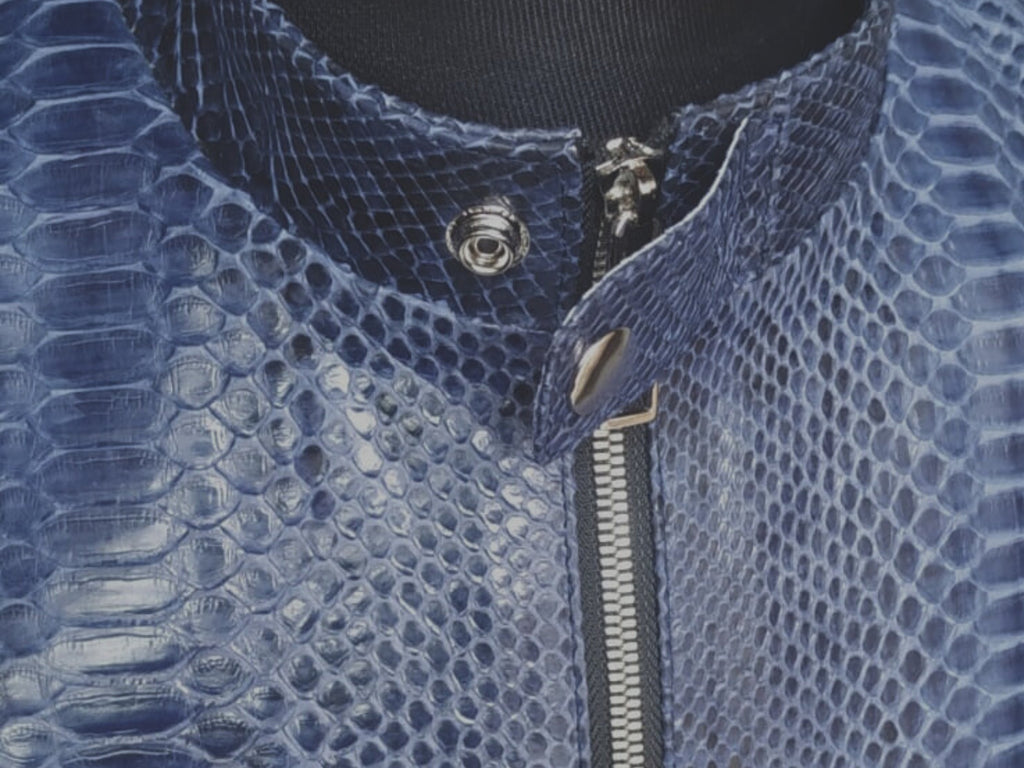 Blue snakeskin leather jacket collar and front zipper detail with snap tab