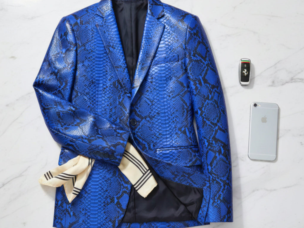 Men's blue snakeskin blazer, close-up of textured fabric and pocket flap.