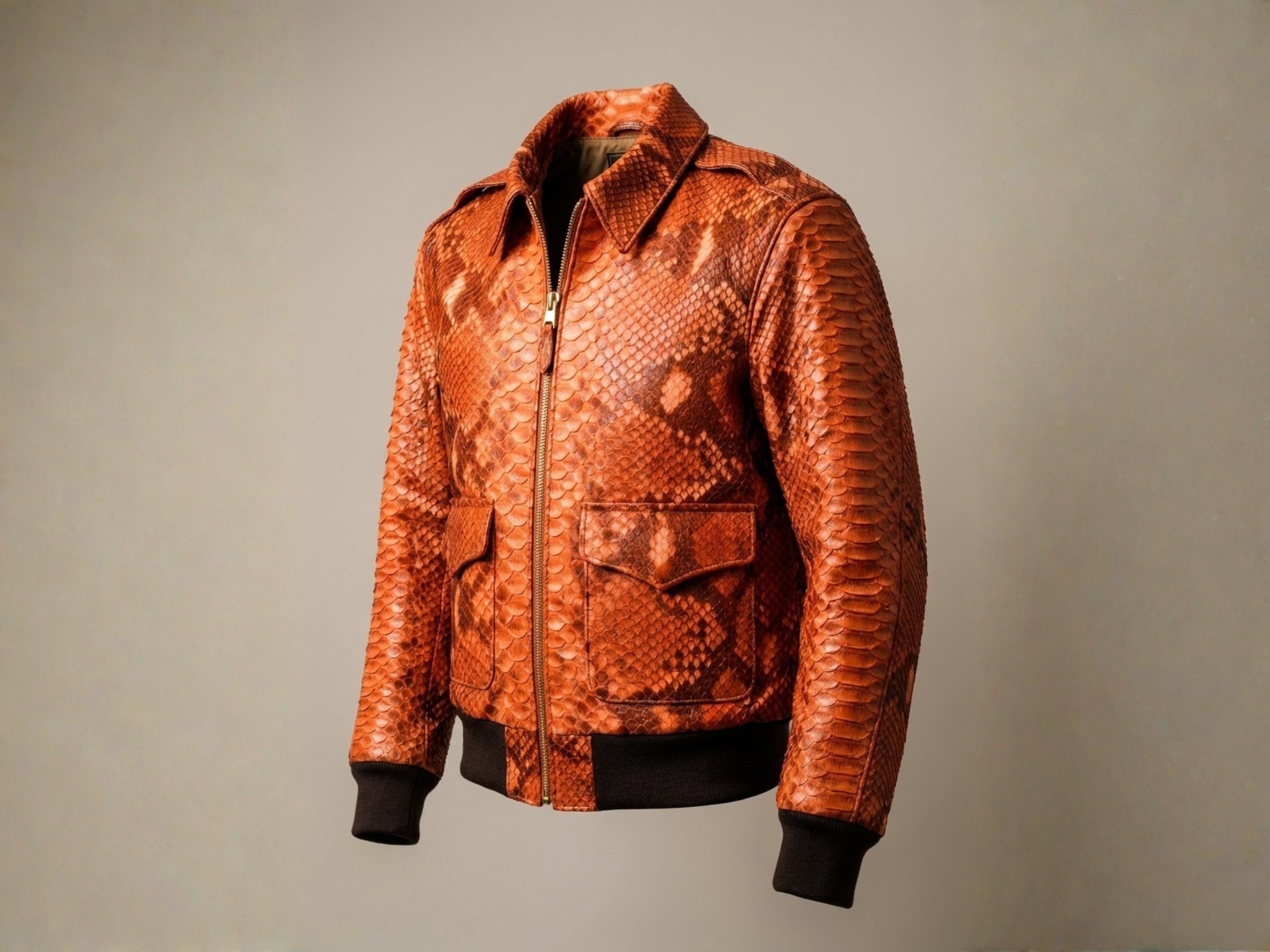 Men's flame orange python snakeskin bomber jacket, front view with flap pockets