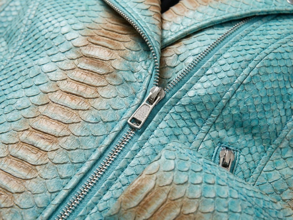 Turquoise snakeskin leather jacket close-up of zipper and overlapping scale panels