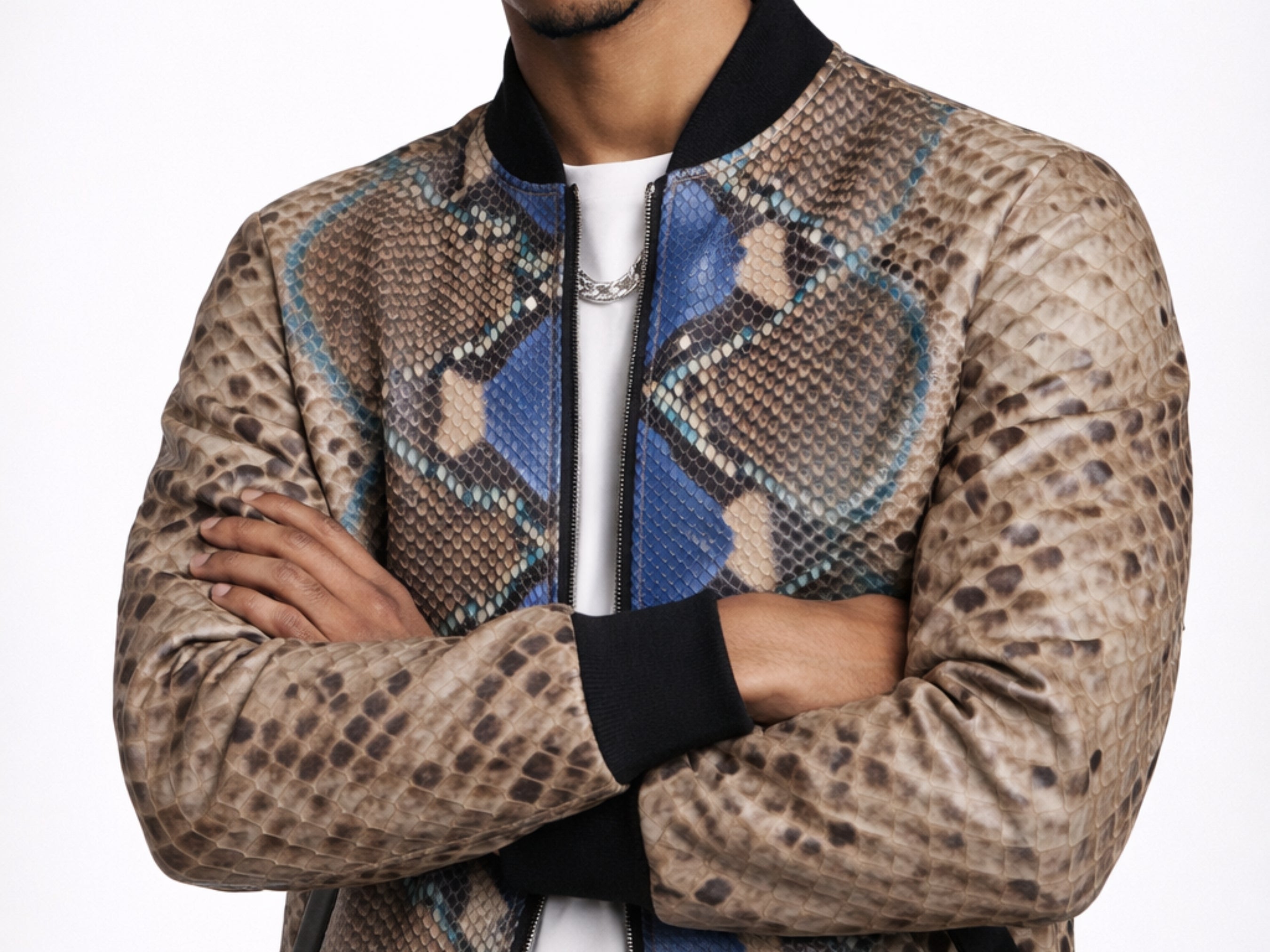 Close-up of men’s python snakeskin bomber jacket sleeves and chest panel with zip front