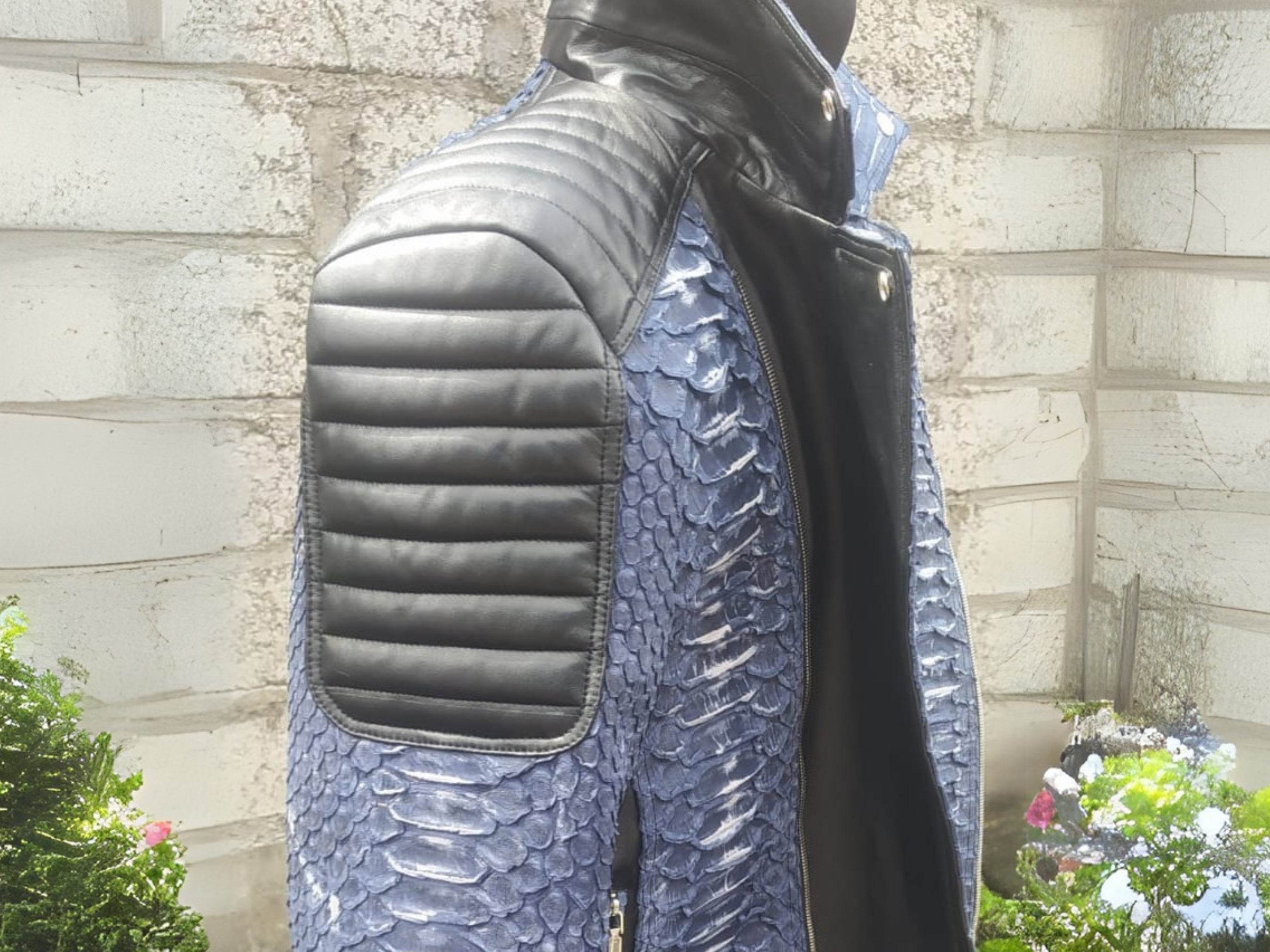 Blue python-texture biker jacket with black quilted sleeve panel and diagonal zip