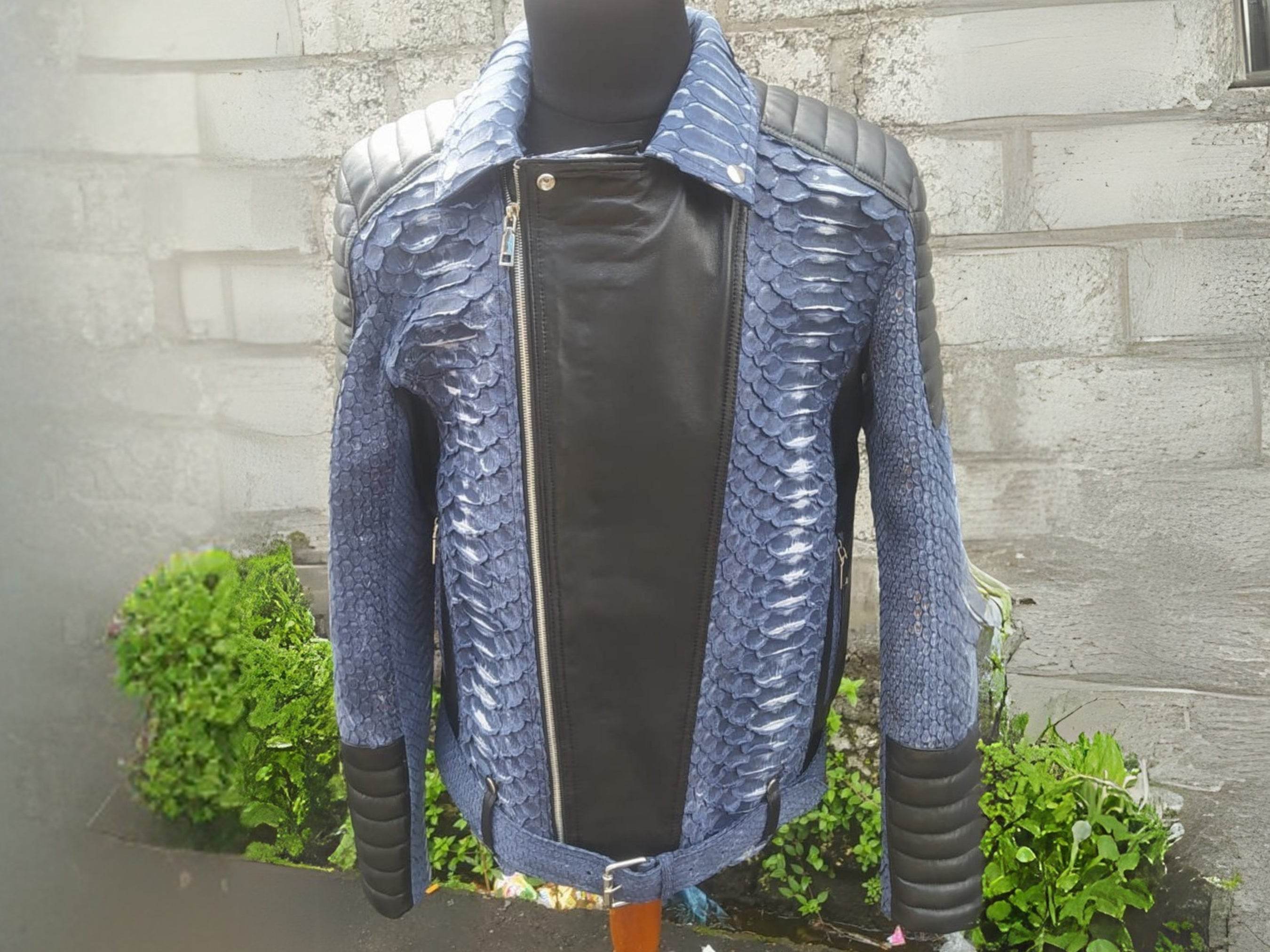 Blue python-texture biker jacket with black center panel, asymmetrical zip, snap buttons