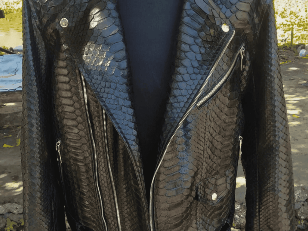 Python-skin leather motorcycle jacket front with glossy scales, zip pockets, and snaps