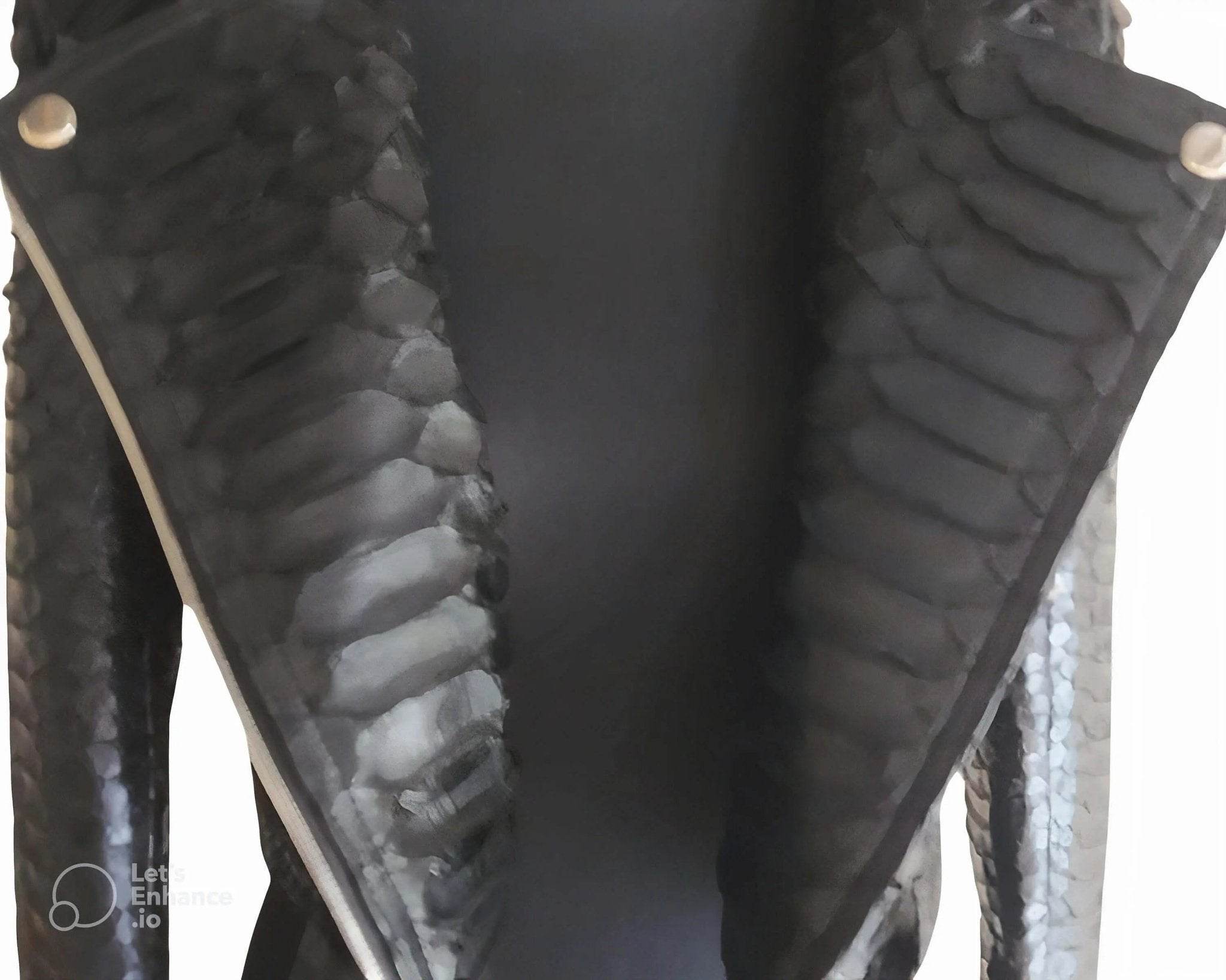 Black python snakeskin leather jacket with off-center front zip and textured shoulders