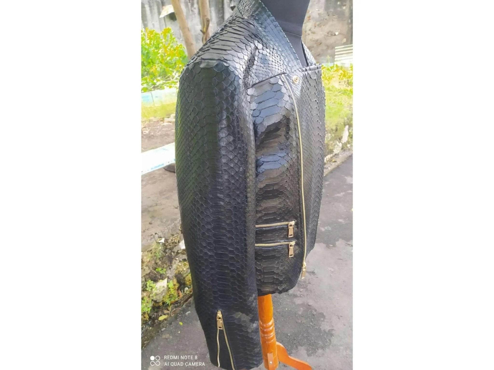 Black snakeskin leather jacket side view with gold-tone zip and pocket