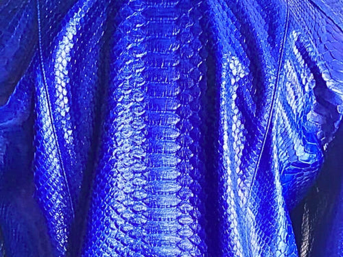 Blue python leather jacket close-up, embossed snake-skin texture and ribbed panels