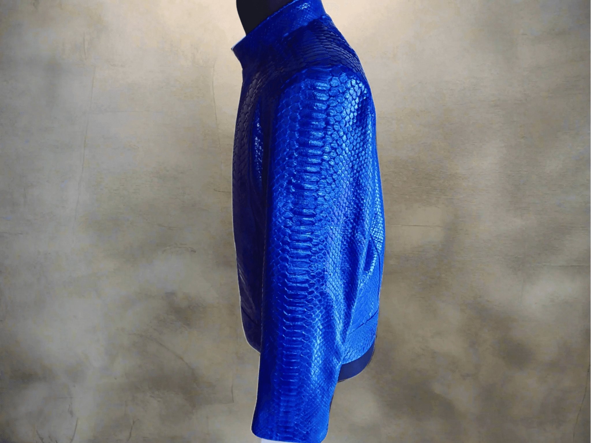 Blue python leather jacket side profile, full sleeve and textured snake-skin surface