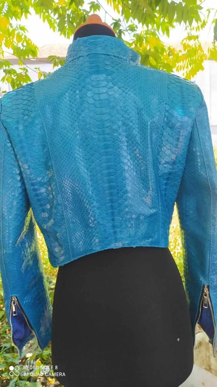 Turquoise textured bolero jacket, open back view with cropped shoulders