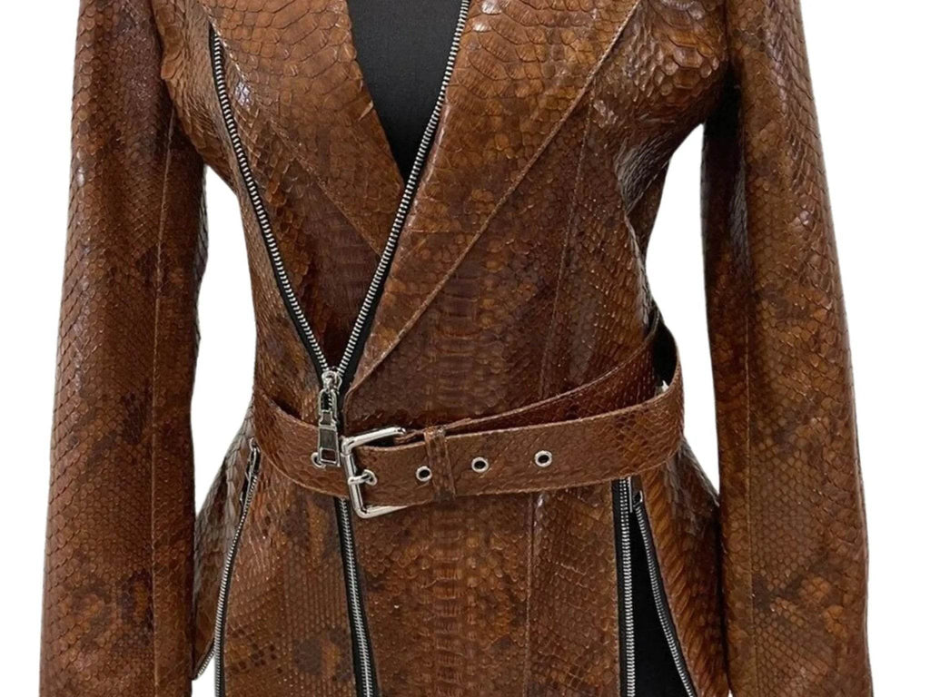 Brown leather jacket detail: diagonal front zipper and studded waist belt strap