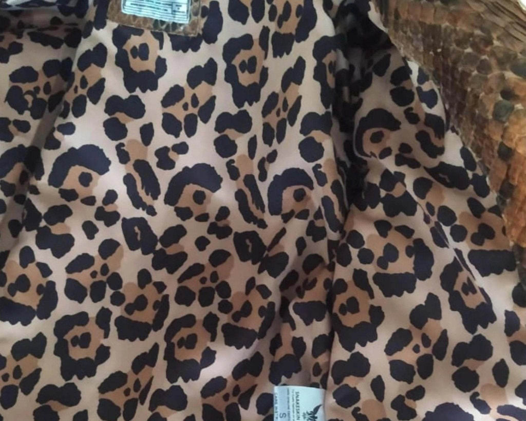 Leopard-print fabric lining with care label near the upper back