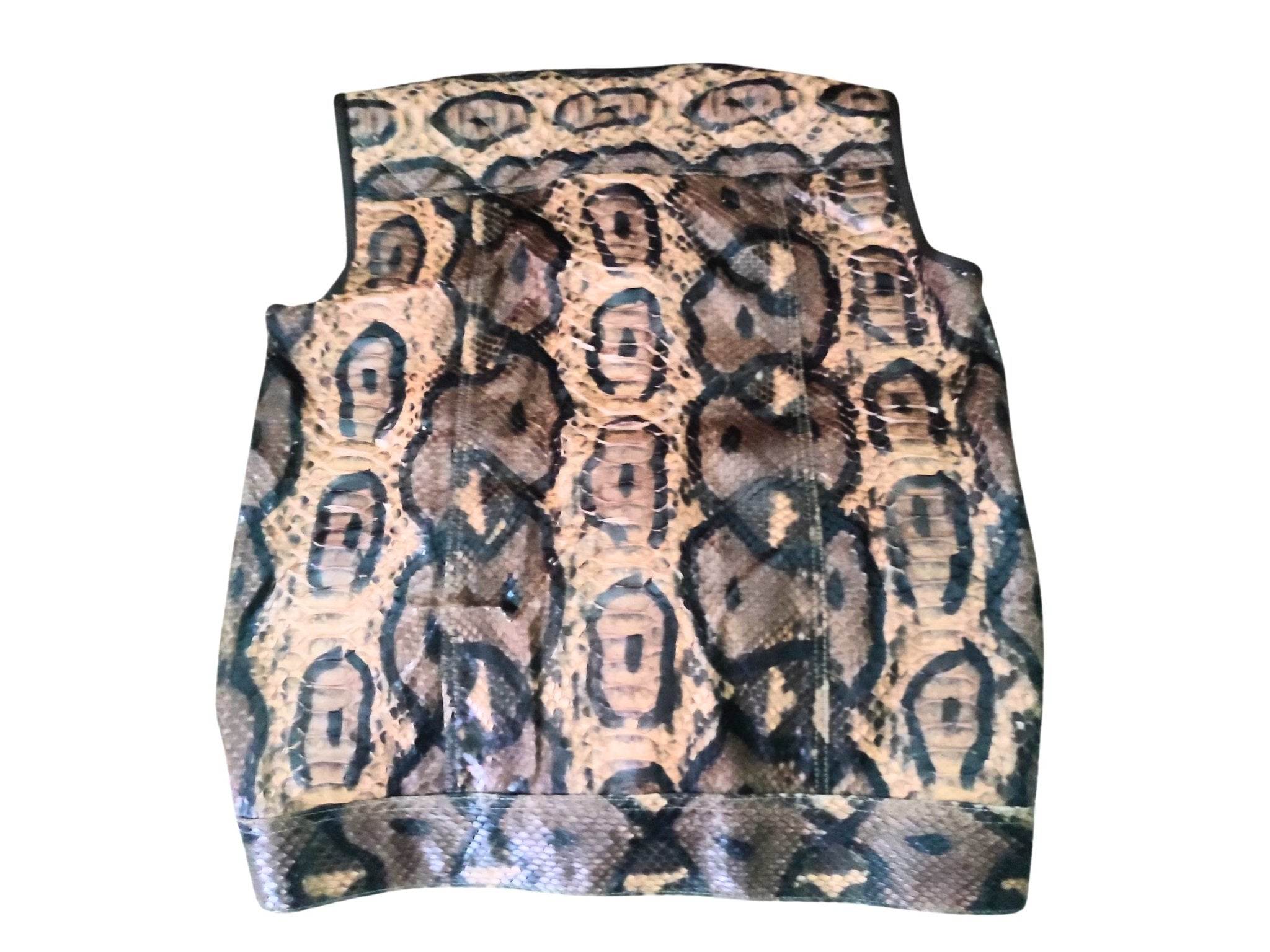 Motorcycle leather vest, sleeveless back panel in tan and dark patterned fabric.