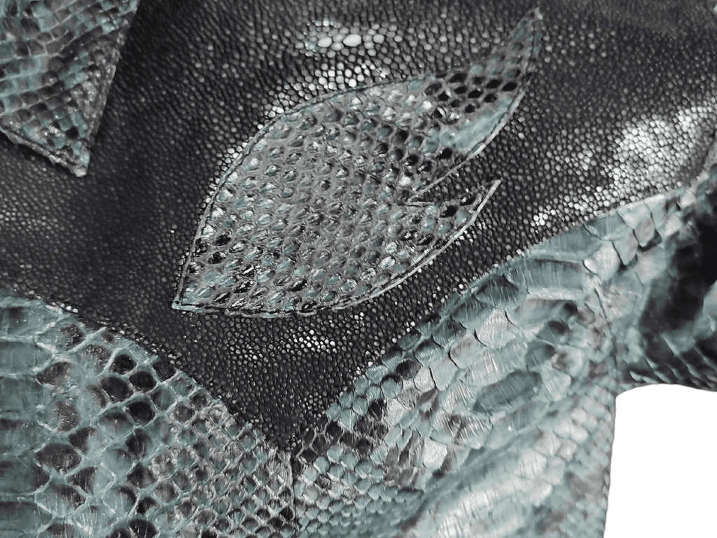 Close-up of python snakeskin leather scales in light and dark gray tones