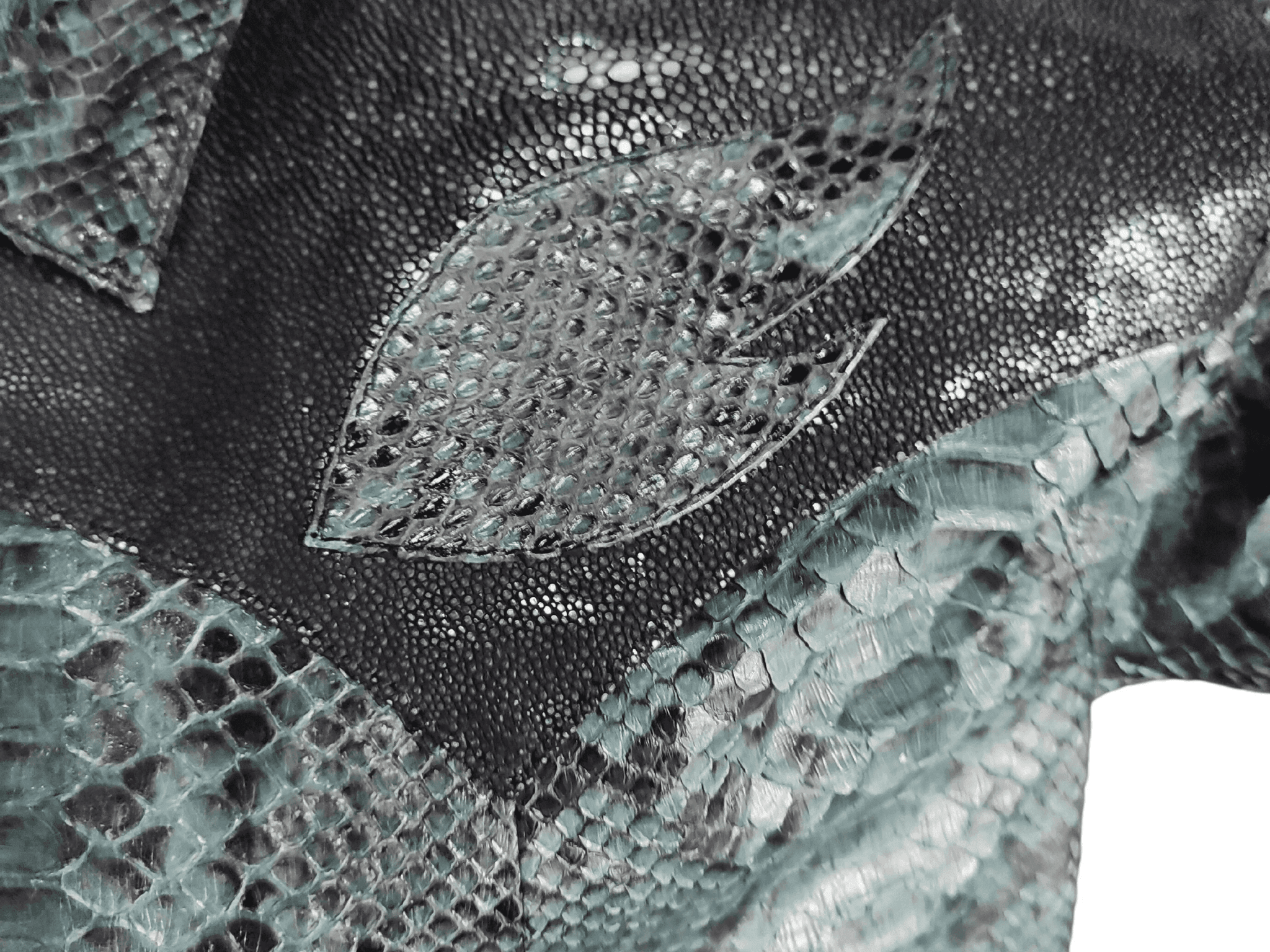 Close-up of python snakeskin leather scales in light and dark gray tones