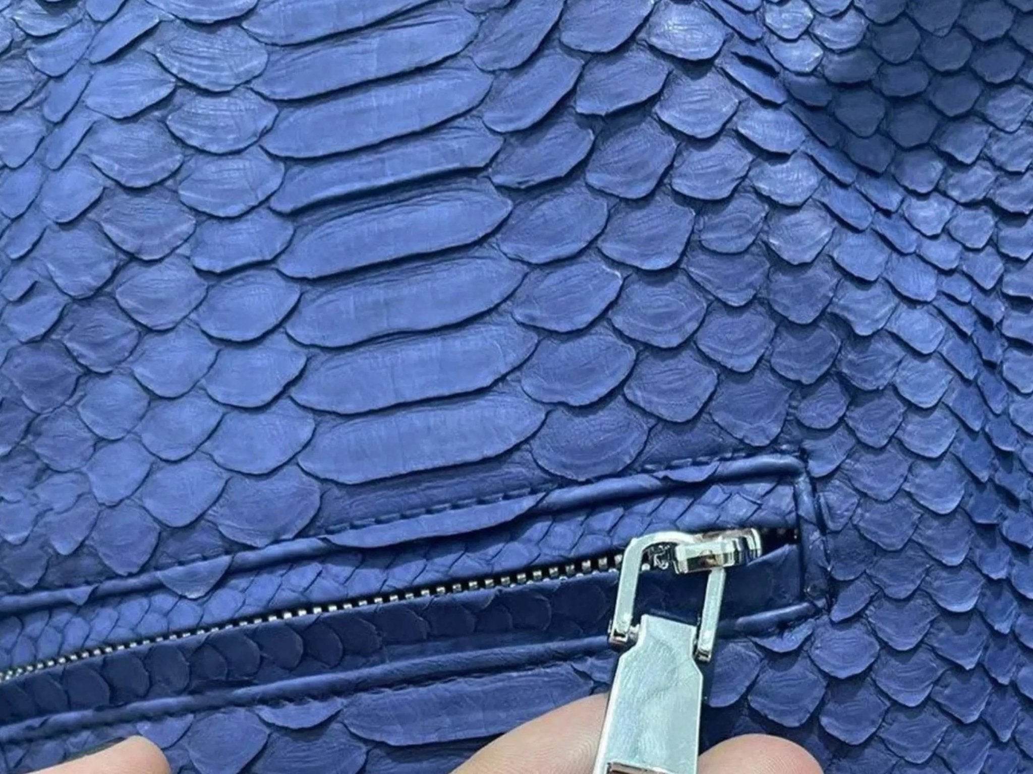 Blue snakeskin leather jacket chest pocket with zip and metal pull tab
