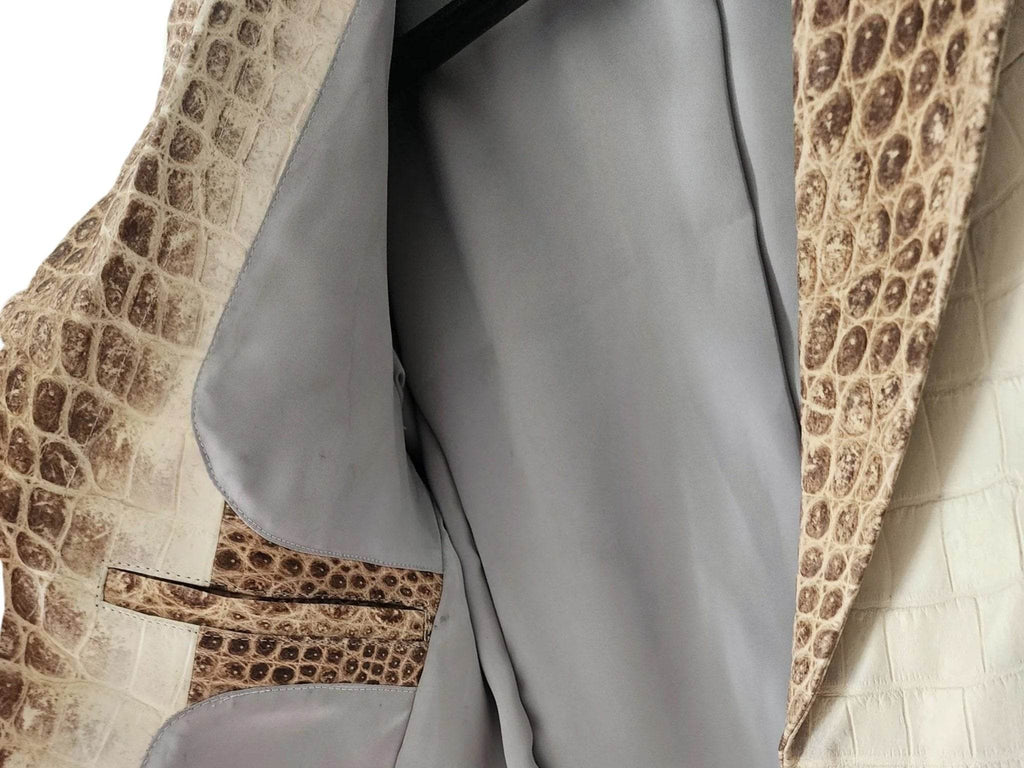 Blazer jacket interior view, gray lining and brown alligator trim along button placket