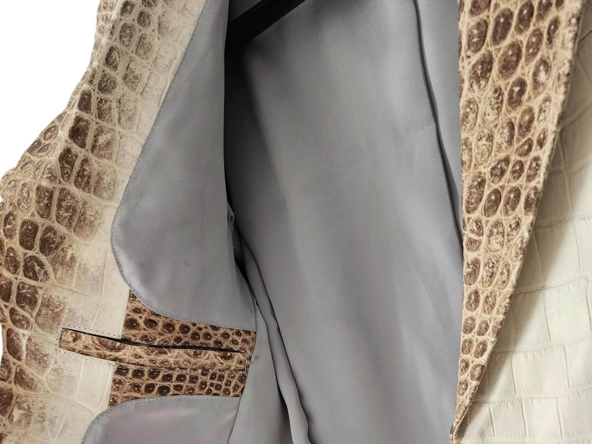 Blazer jacket interior view, gray lining and brown alligator trim along button placket