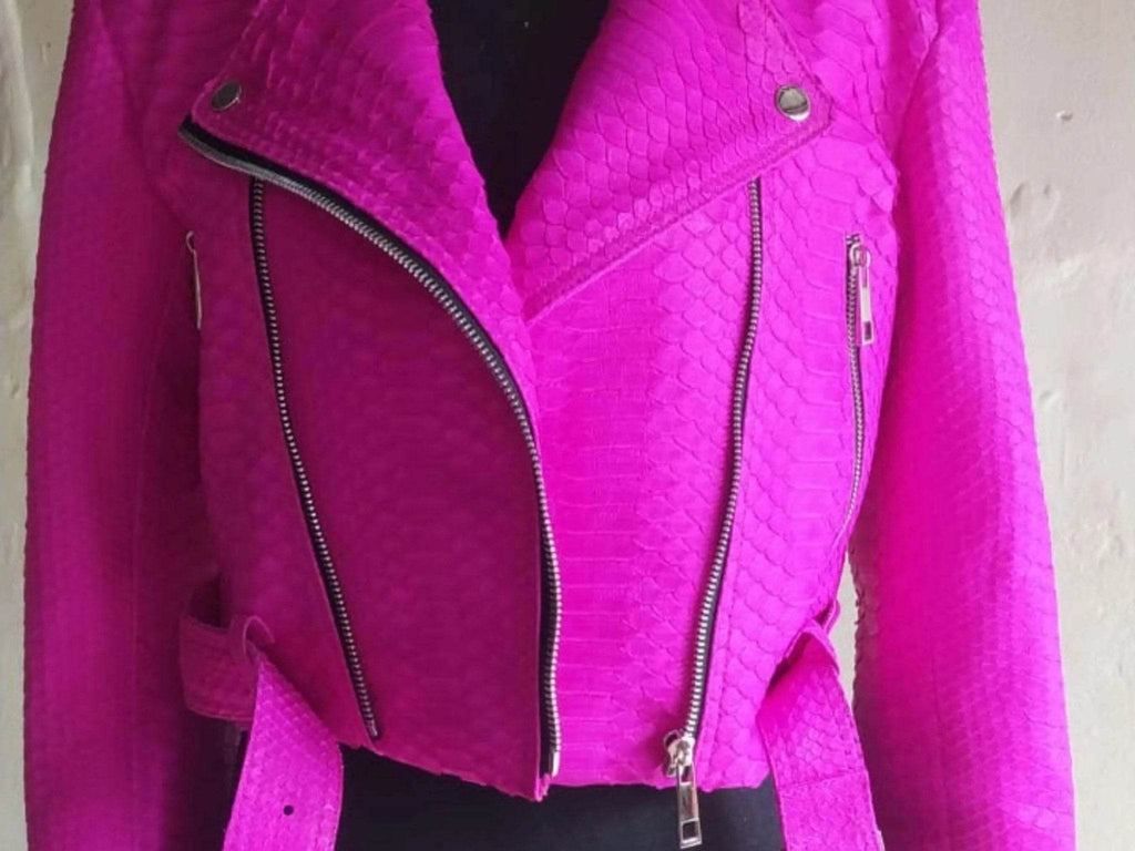 Hot pink snakeskin leather jacket detail with two zip pockets and silver hardware