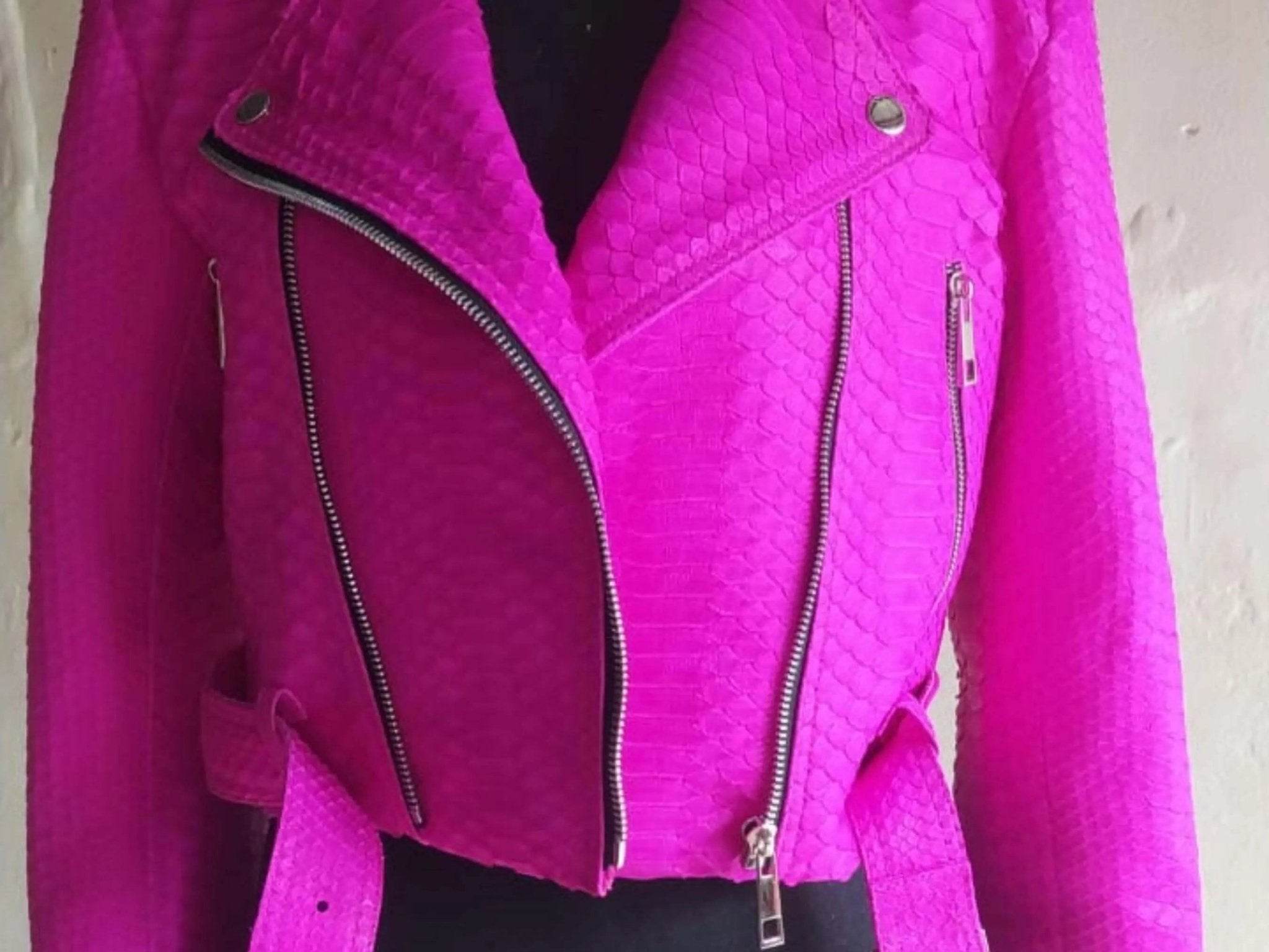 Hot pink snakeskin leather jacket detail with two zip pockets and silver hardware