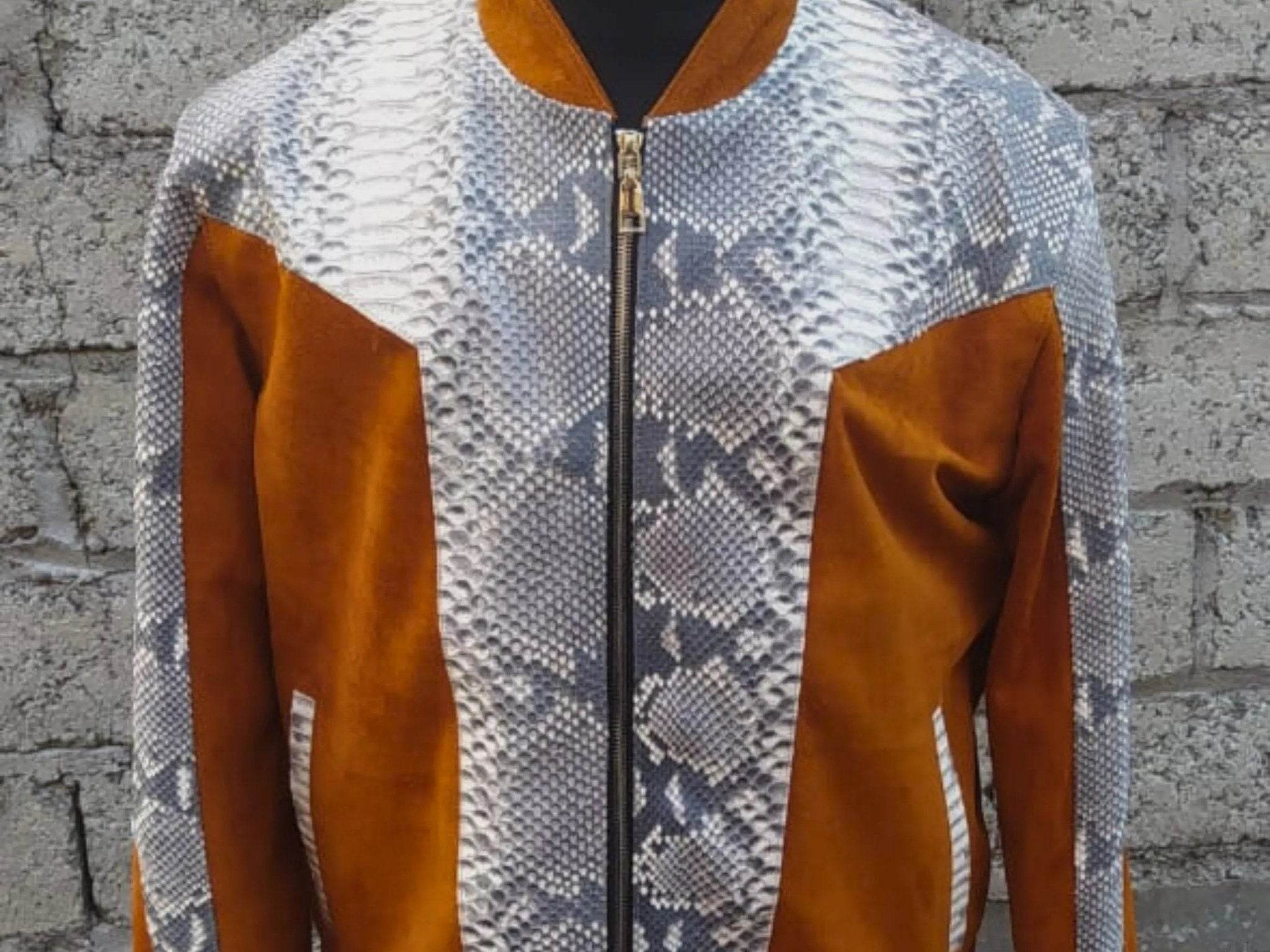 Python jacket front close-up, mock neck zipper with brown/orange chest panel sections