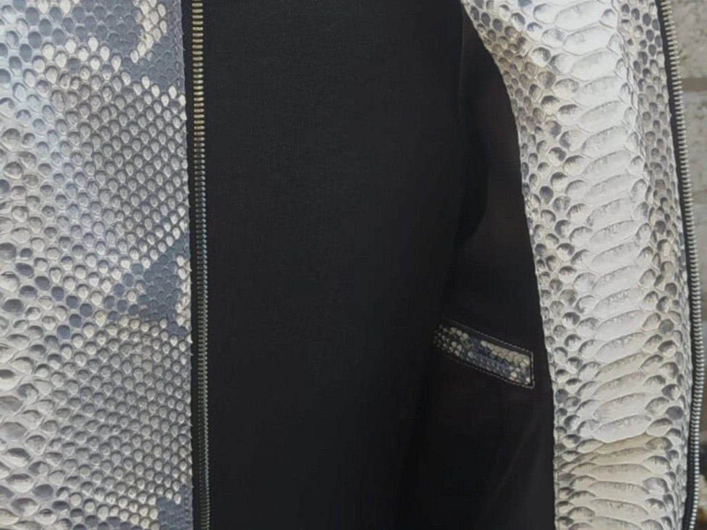 Jacket interior view, dark lining with silver snake-texture outer and zipper edge