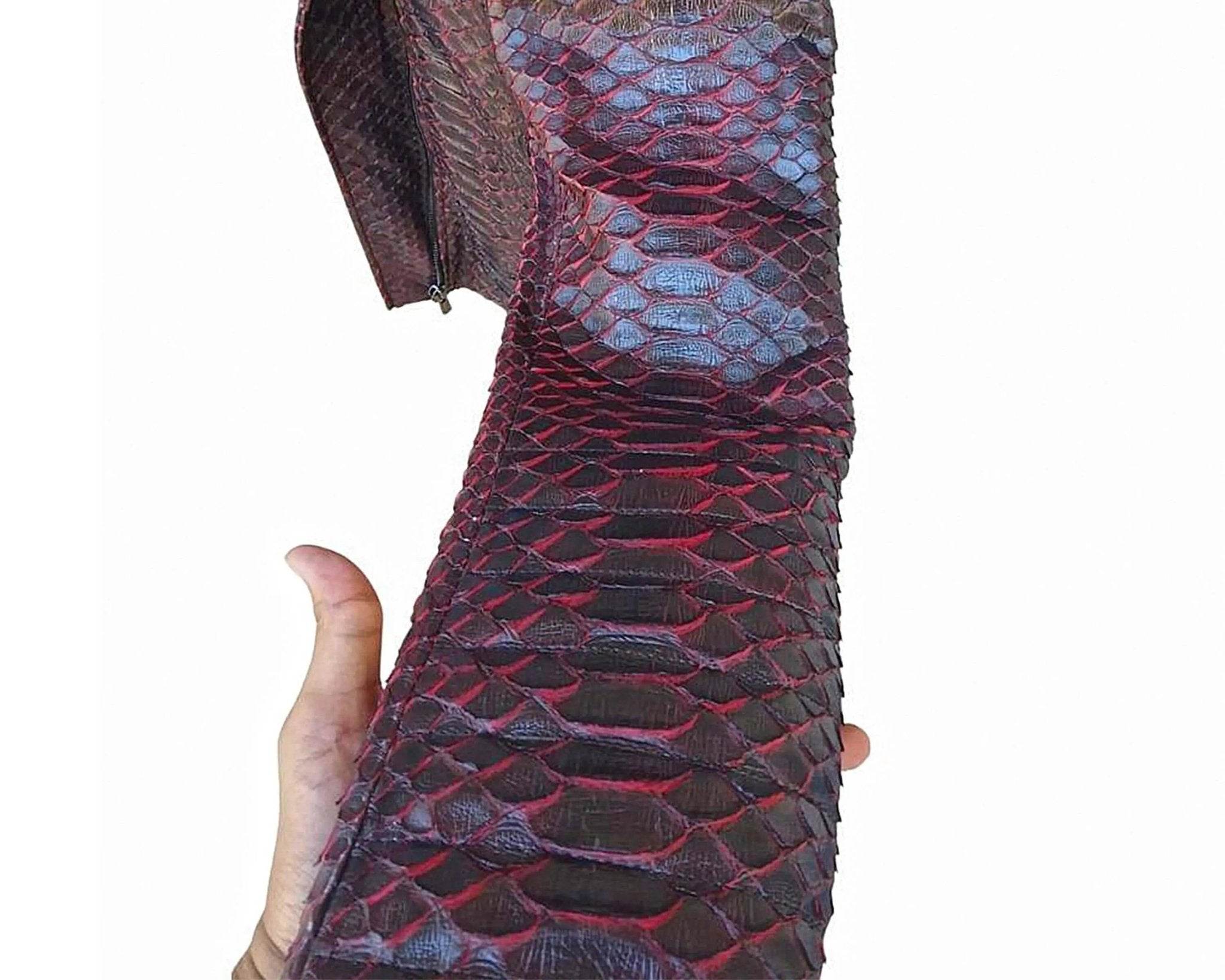 Close-up of snakeskin biker leather jacket sleeve in dark red and blue tones